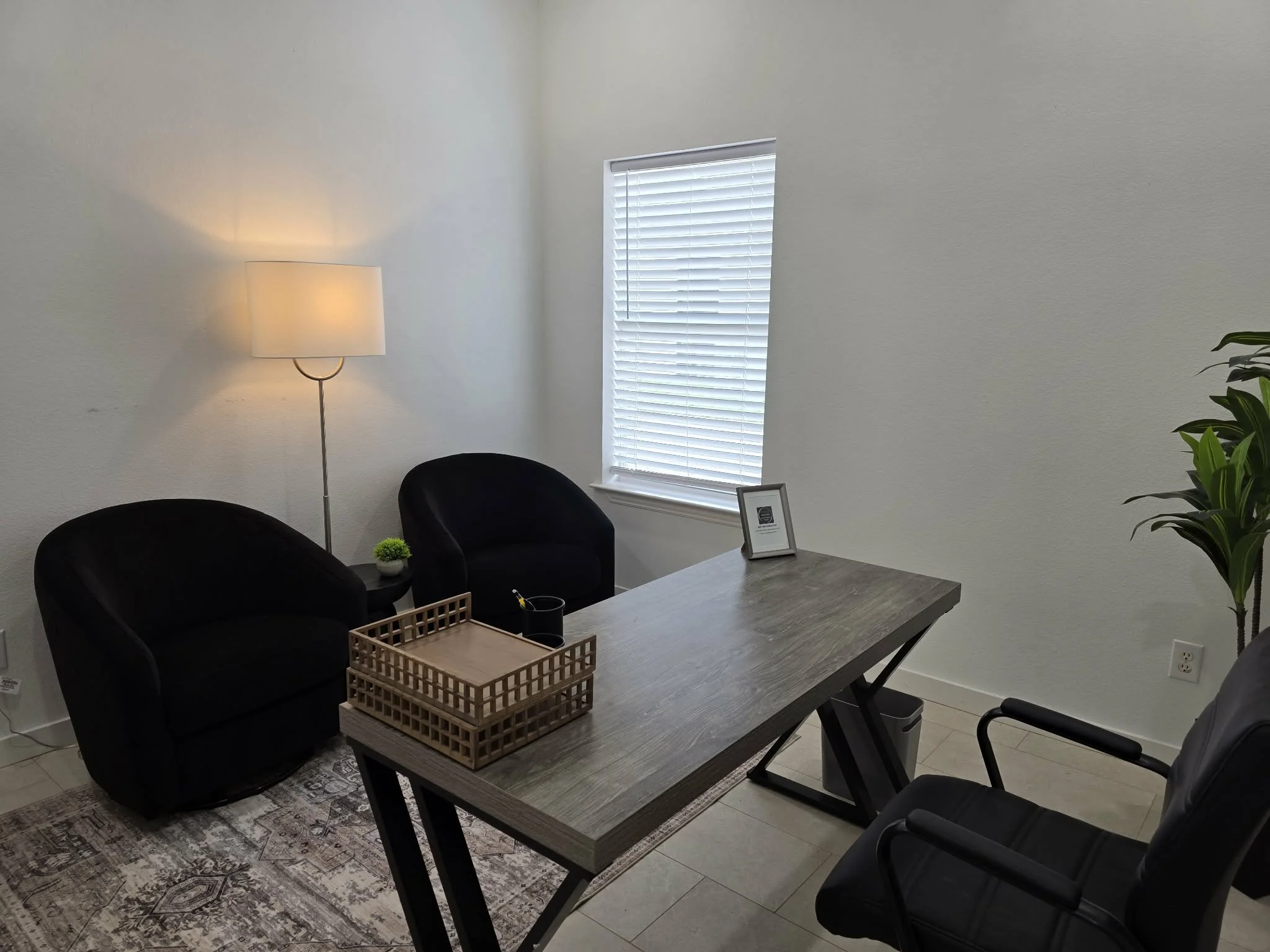 Professional private office rental with desk, seating, and business workspace in Arlington, Texas.