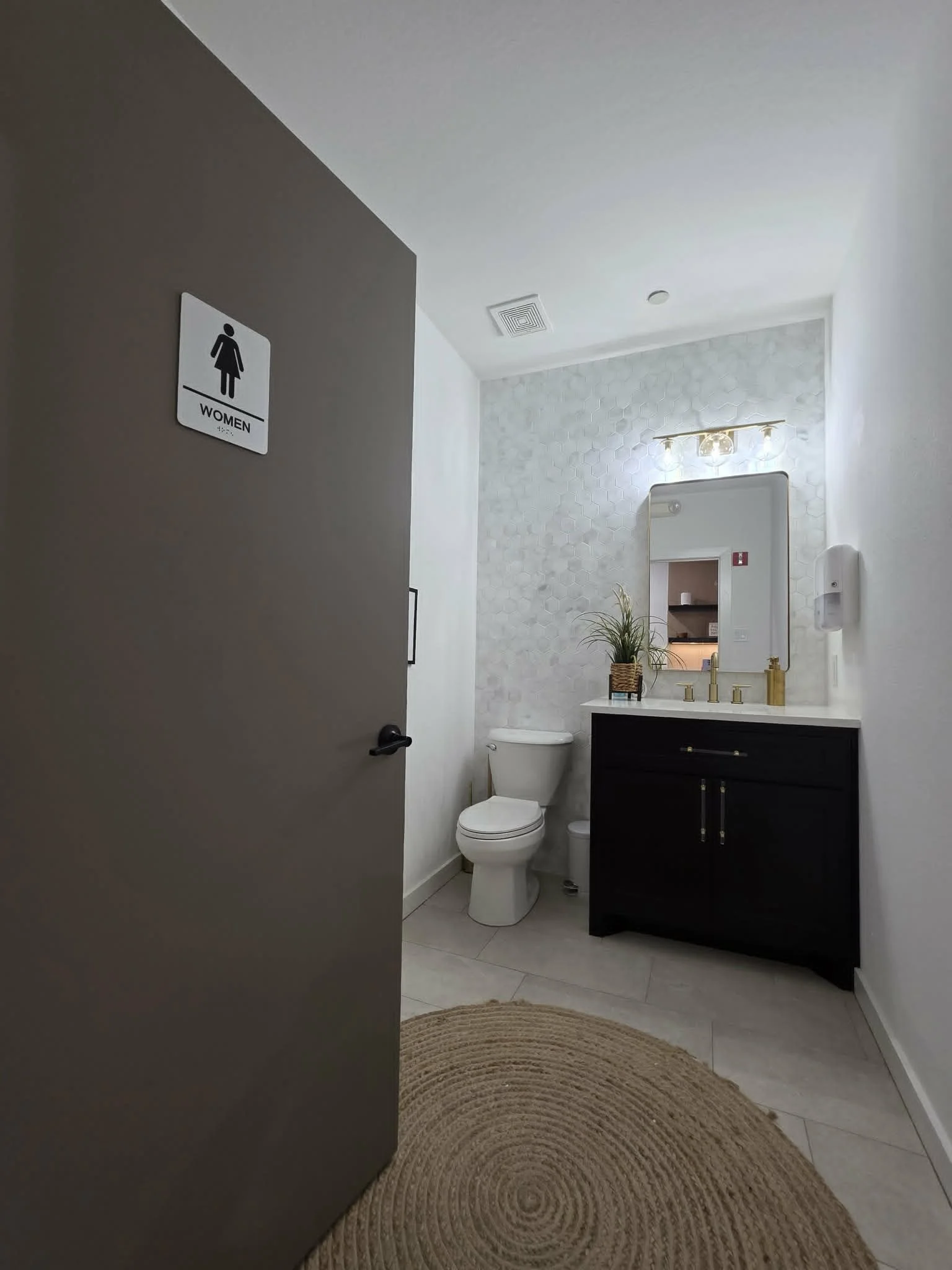 Private restroom facilities available for executive office suite tenants and guests in Arlington, Texas.
