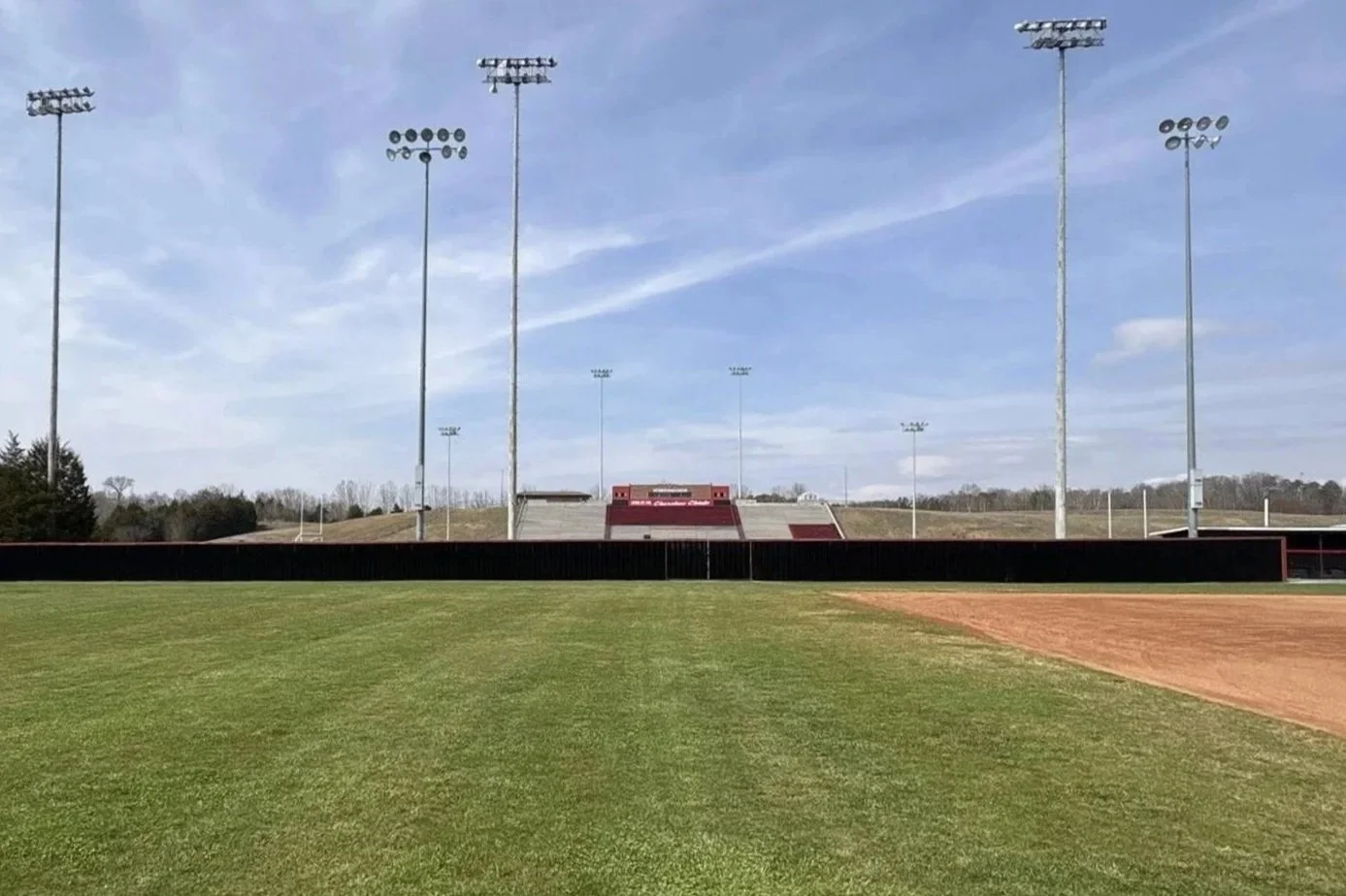 Commercial outfield fence installed by Lane's Fence at a baseball and softball athletic facility.
