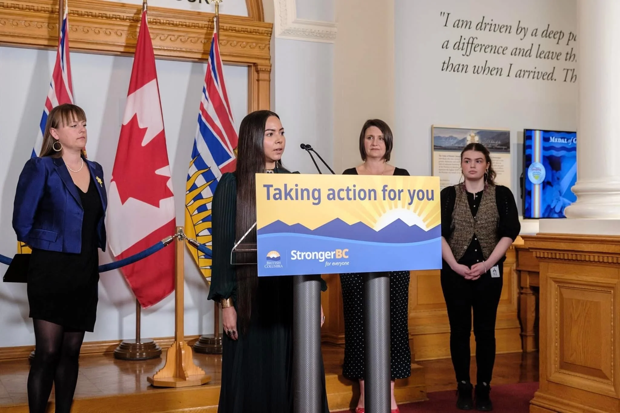 Katisha Paul speaking alongside minister of MCFD 'Taking action for you' and 'Stronger BC for everyone.' Indigenous relations and reconciliation