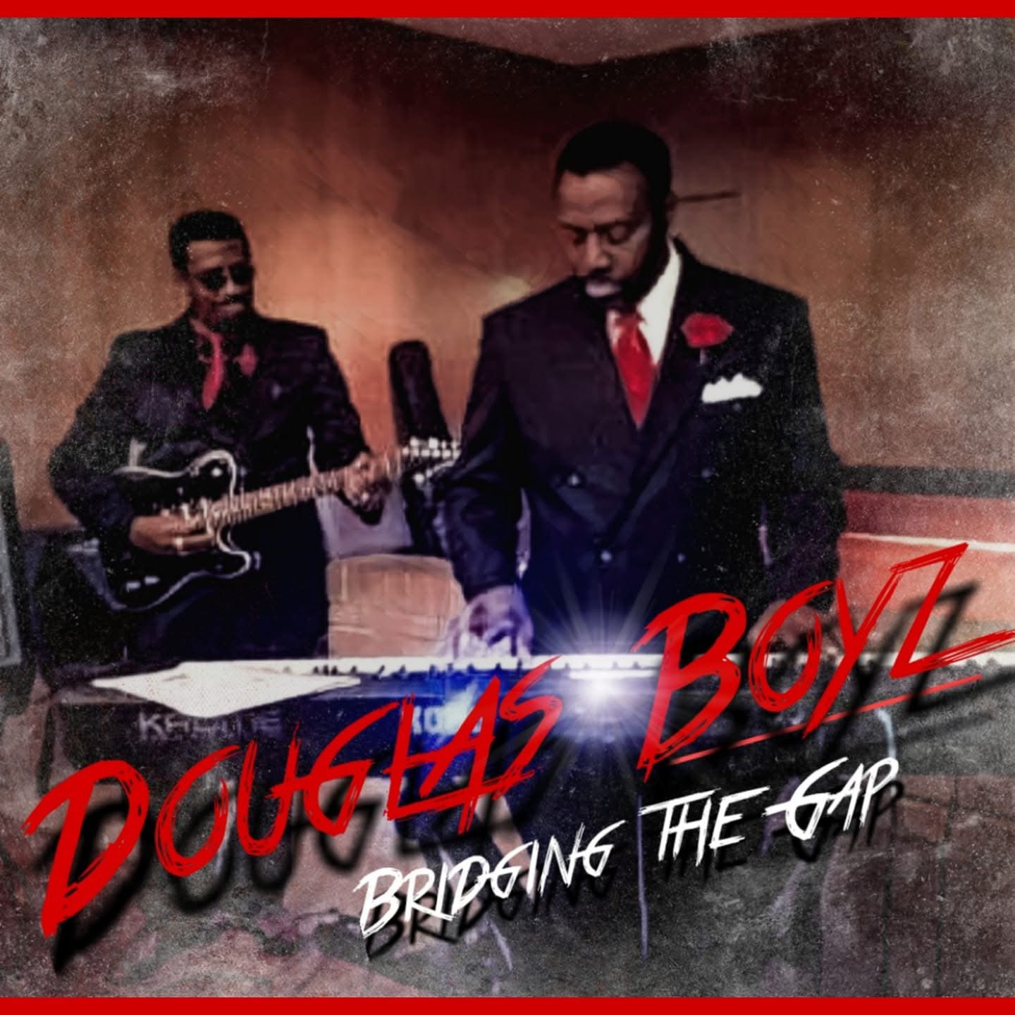 Two men in suits, one playing guitar and the other at a keyboard, performing in a dimly lit room with a textured wall. Text overlay reads 'Douglas Boyz' and 'Bridging the Gap'.