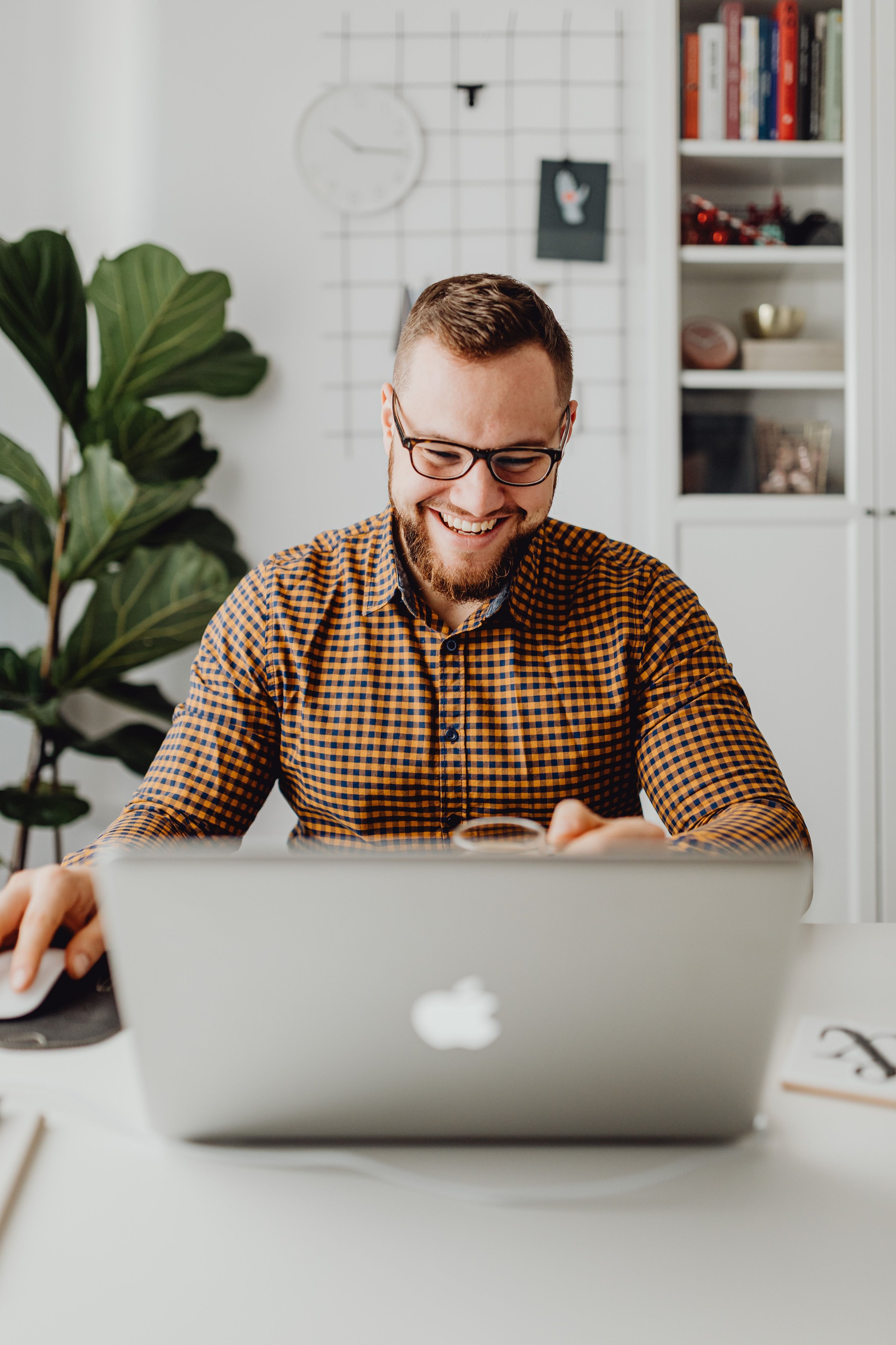 Man working thoughtfully at a desk, representing individual therapy for anxiety and life transitions