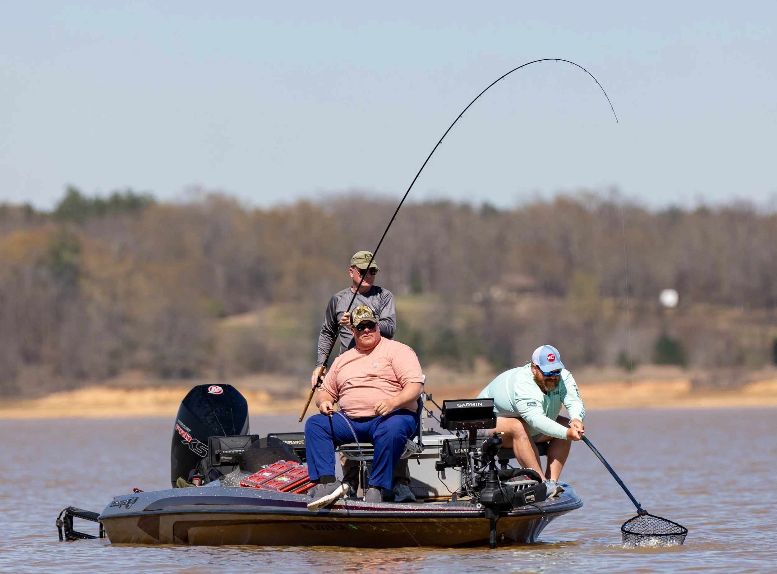 Drew Scott Fishing and clients brining in a crappie on Sardis Lake in North Mississippi during the BnM Poles Sore Lip 'Em All II to raise money for the Ron Wong Legacy Foundation