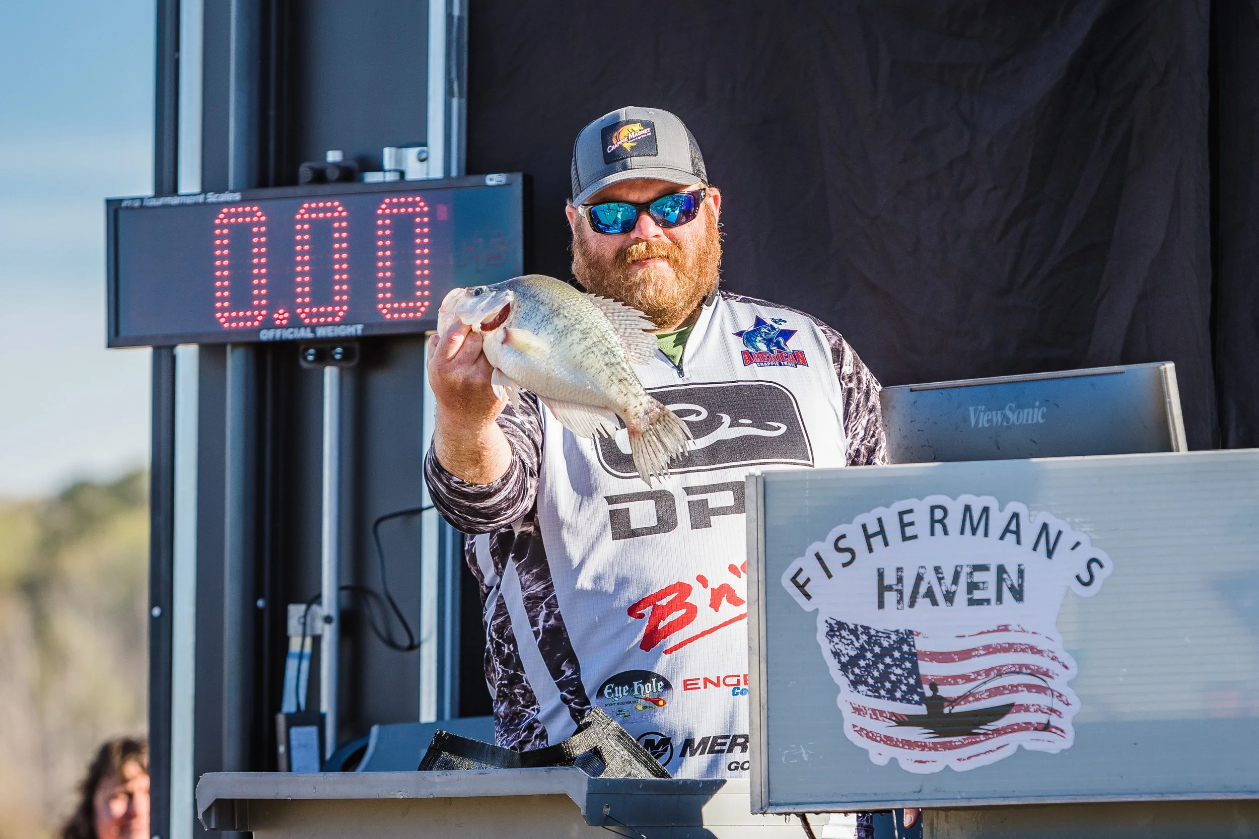 Drew Scott displaying a large crappie during a Crappie Masters Tournament weigh in at Lake D'Arbonne, Louisiana.