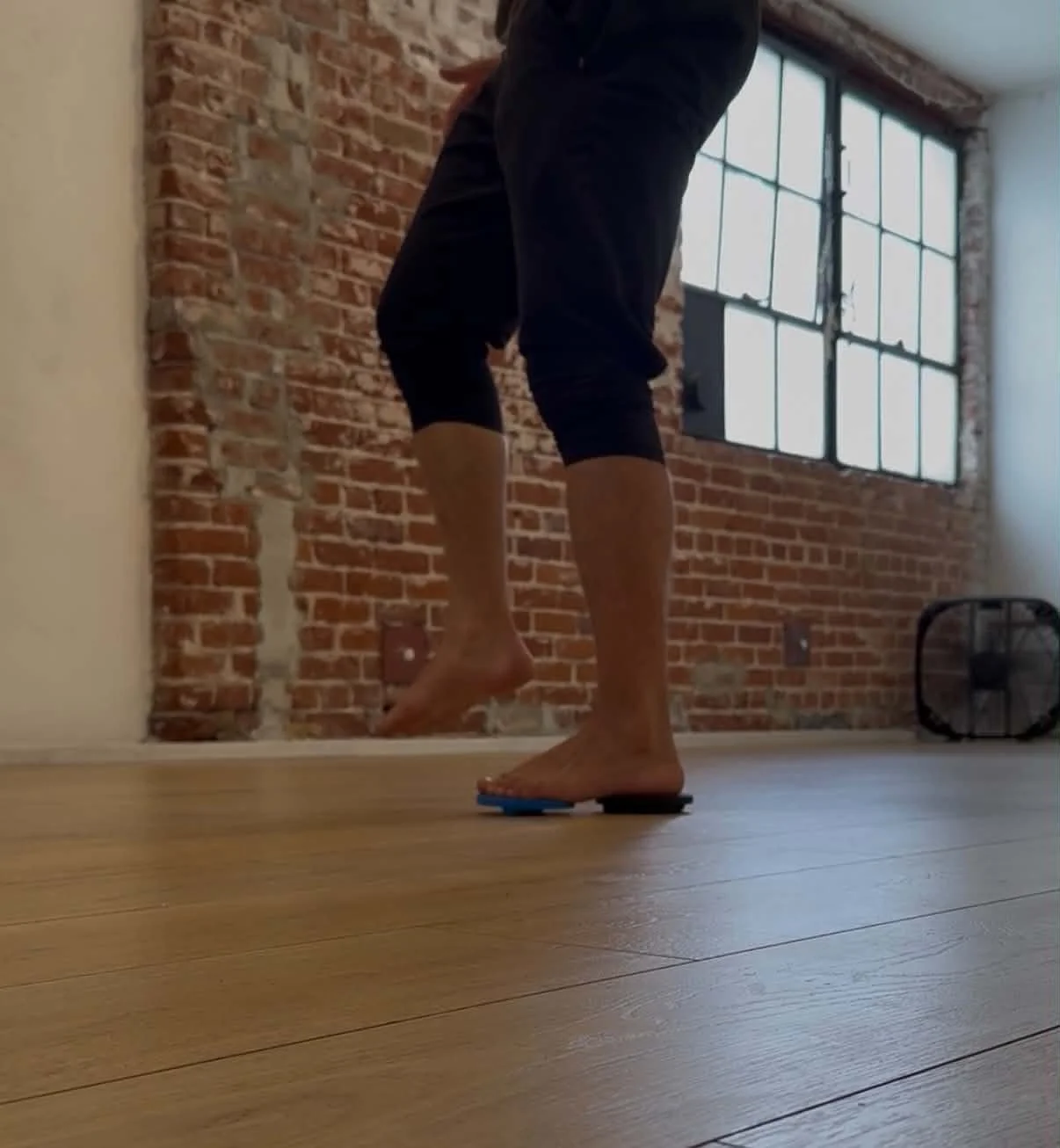 Single leg balance training on Propriofoot proprioceptive platform for chronic ankle sprain treatment at Athlete Lab Performance Chiropractic Long Beach CA