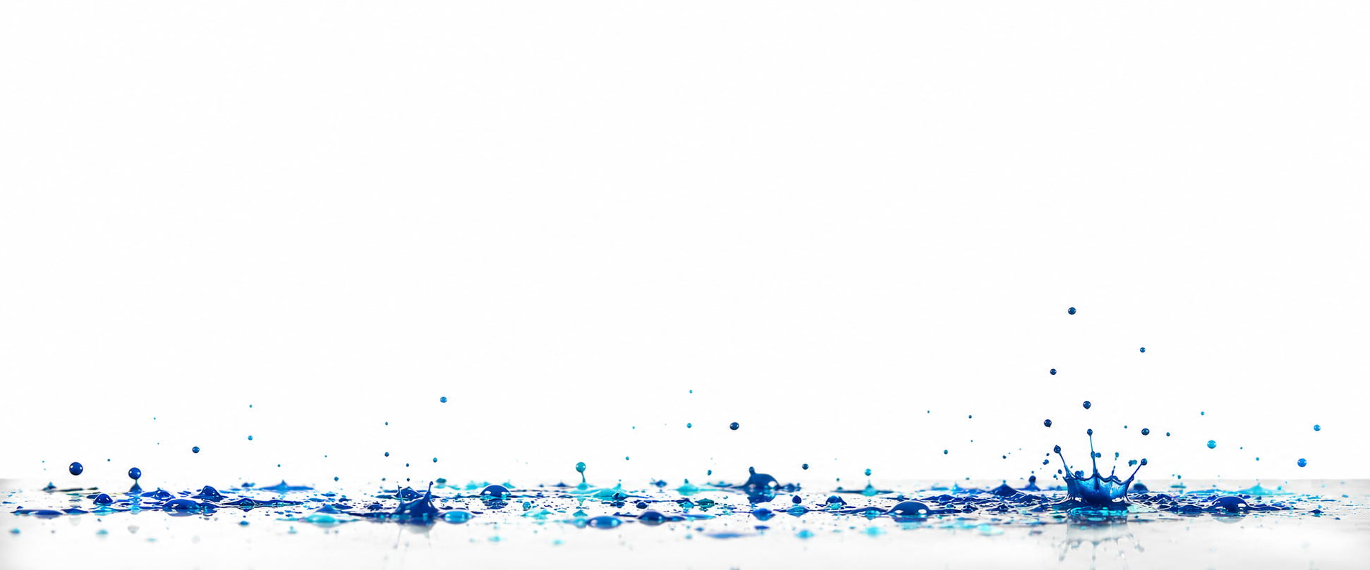 Blue paint droplets splashing on a white background.