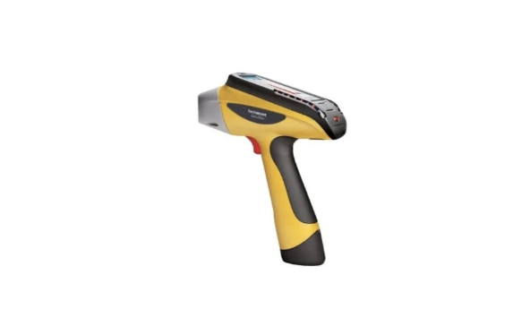 A handheld barcode scanner with a yellow and black design.