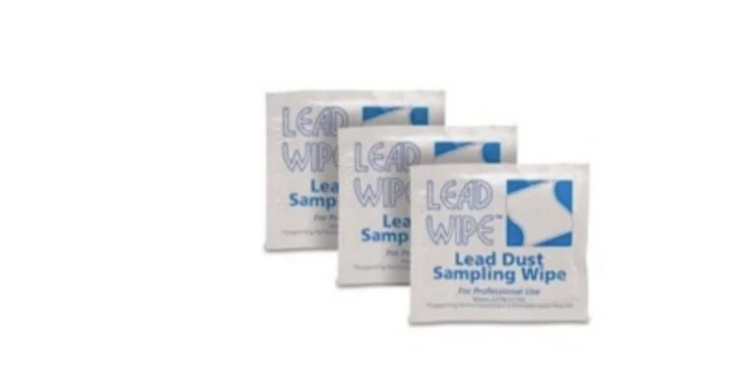 Three packages of lead dust sampling wipes arranged in a row.