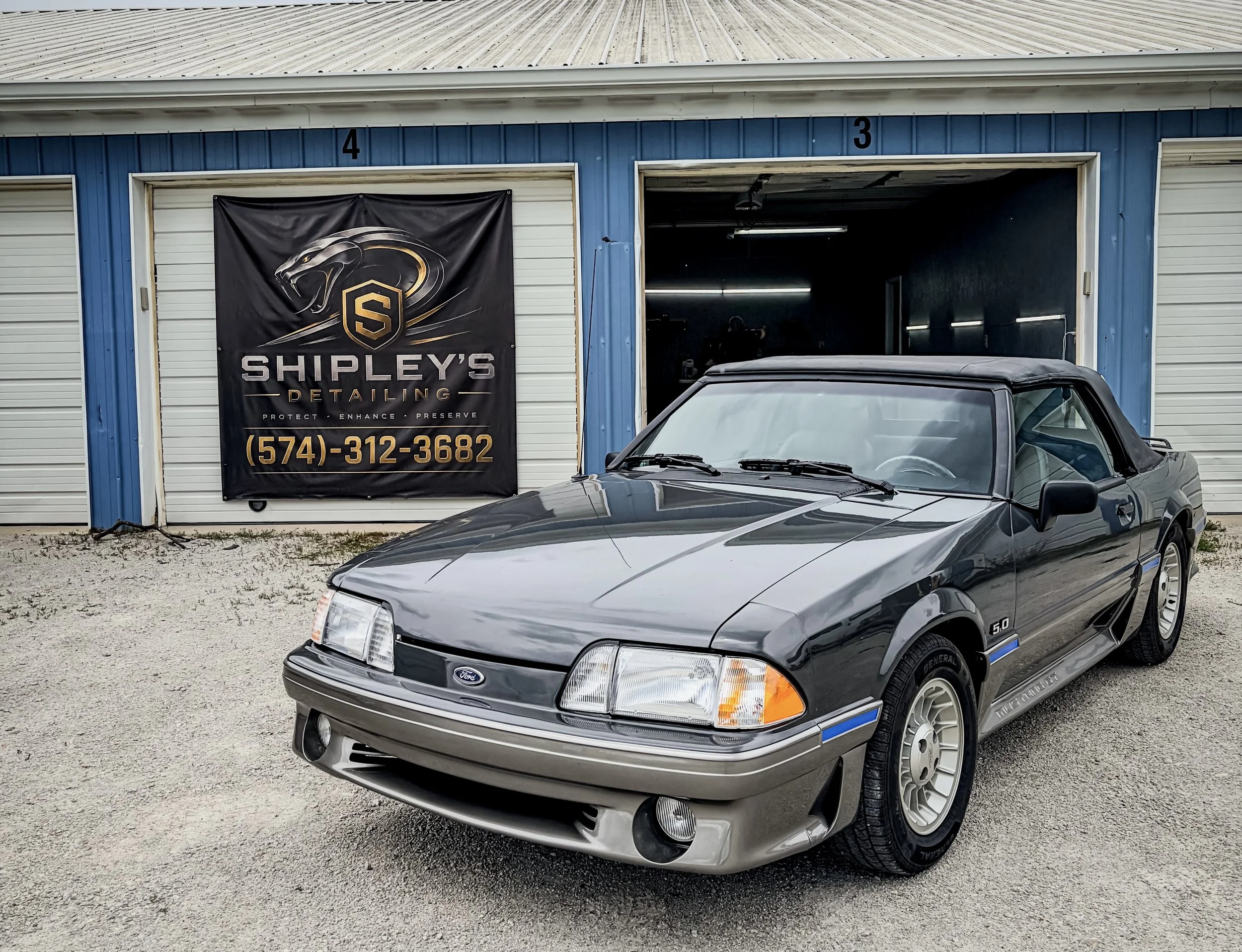 Founder of Shipleys Detailing LLC. Ford Mustang in front of one of Jaden’s establishments.