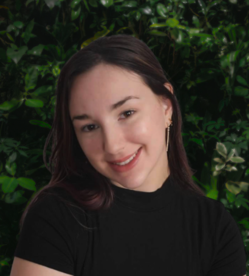 A young woman with medium-length brown hair smiling at the camera against a neutral background.