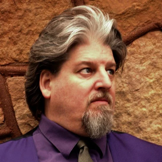 Photograph of the author on an odd hair day.