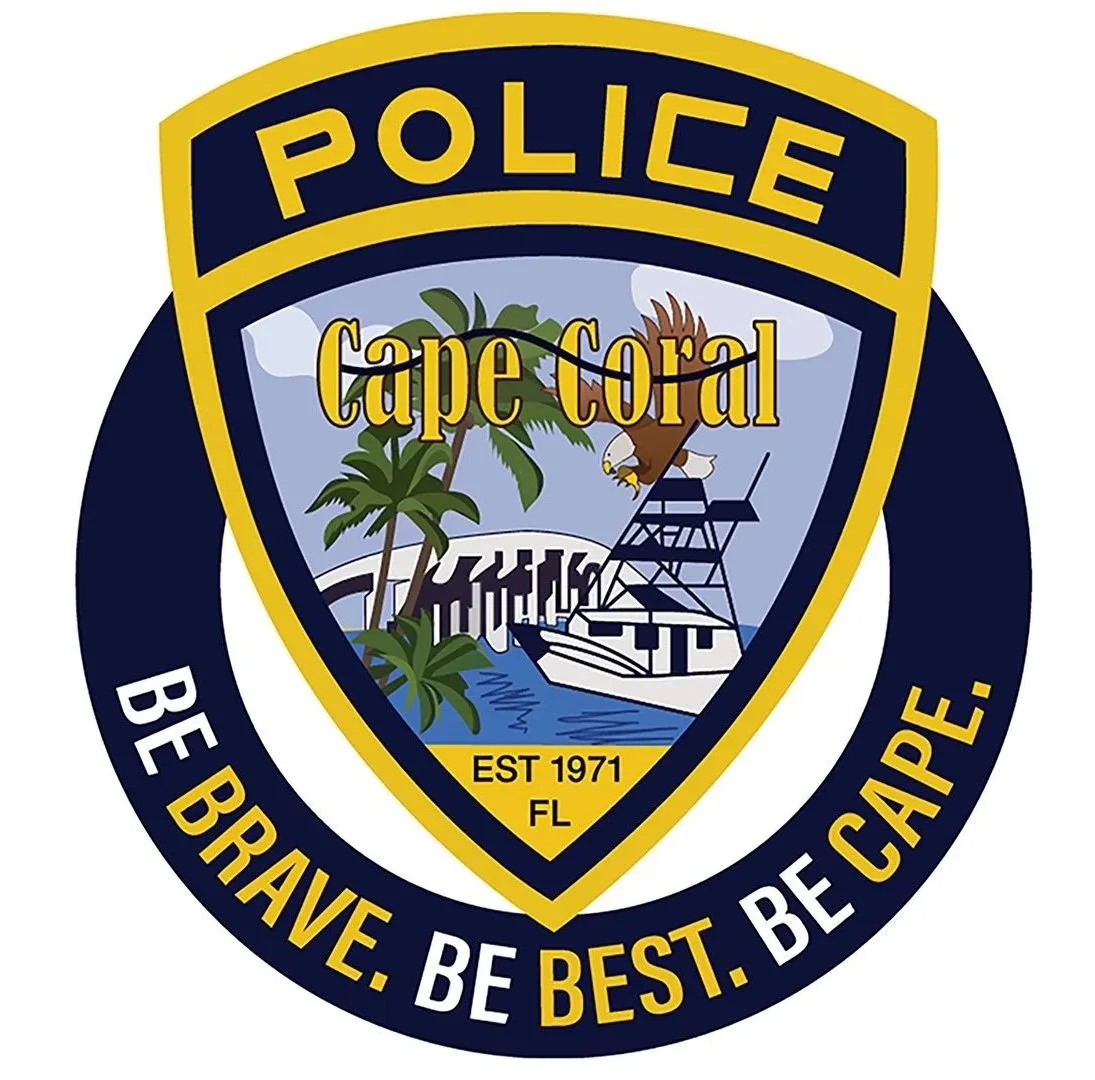 Police badge emblem for Cape Coral, Florida, established 1971, featuring a scenic Florida coast with palm trees, a boat, and a lighthouse.