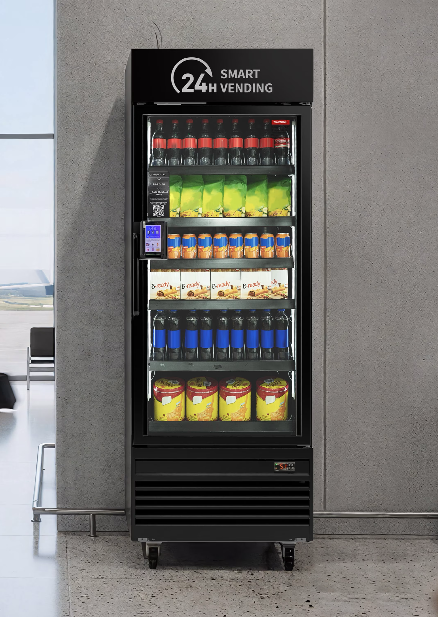 A vending machine with a sign above it indicating 24-hour smart vending services. The machine contains bottles of soda, snacks, and other refreshments.