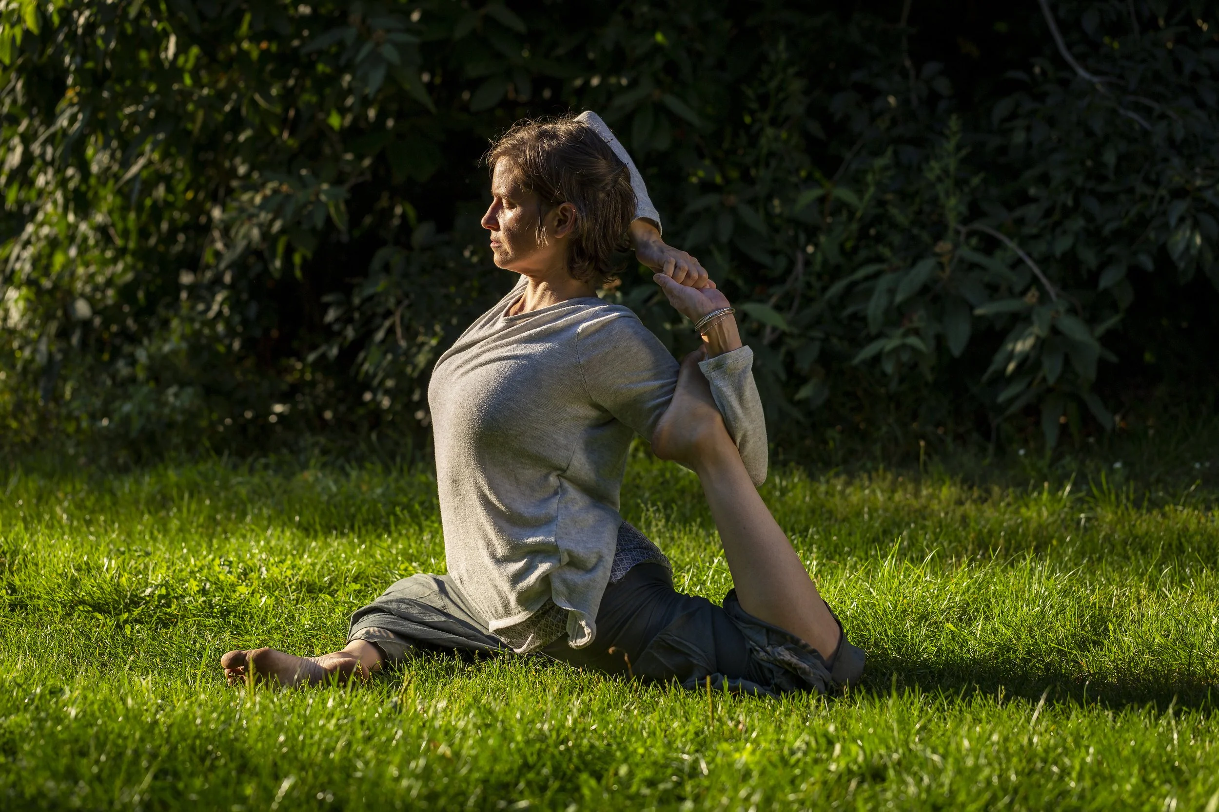 Yoga at Weissensee in the grass in the park around the lake in our neighborhood.