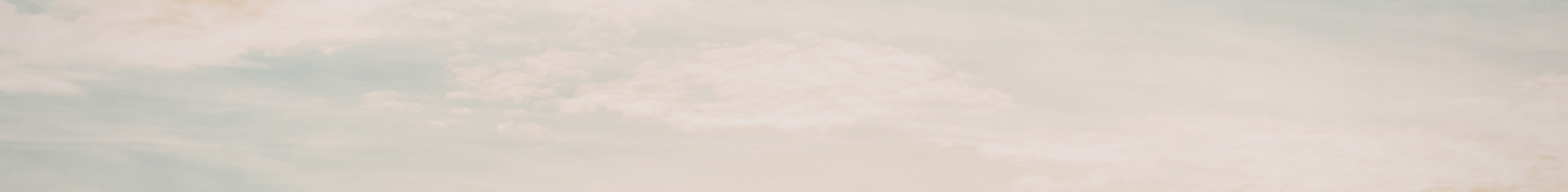 A clear sky with some clouds.