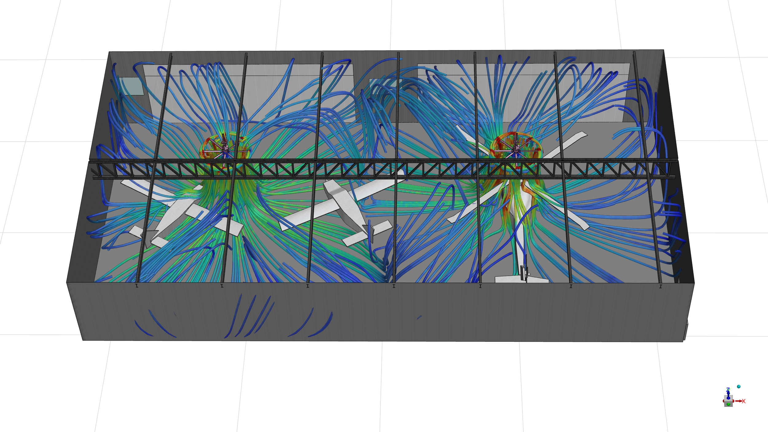 Spinning HVLS fans in an aircraft hangar showing air entrainment through small wall louvres for ventilation when the hangar doors are closed