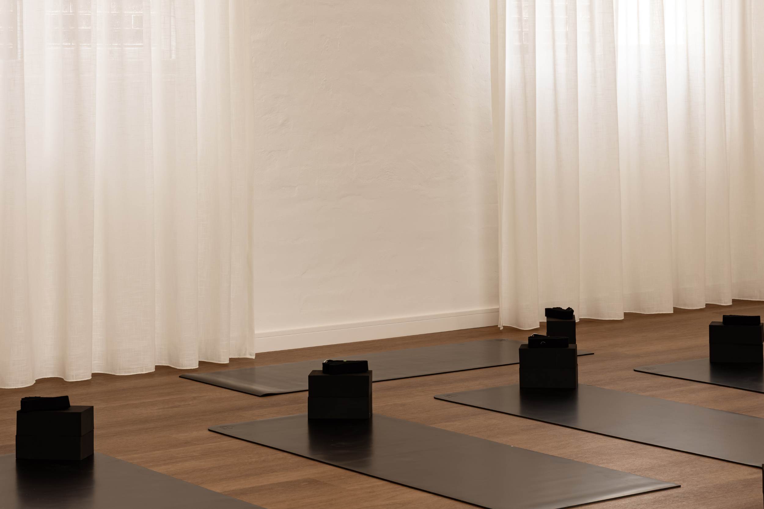 Yoga props arranged in a light-filled studio space for Flow Republic classes including Vinyasa Yoga, Yin Yoga, Meditation, Breathwork and Sound Bath.