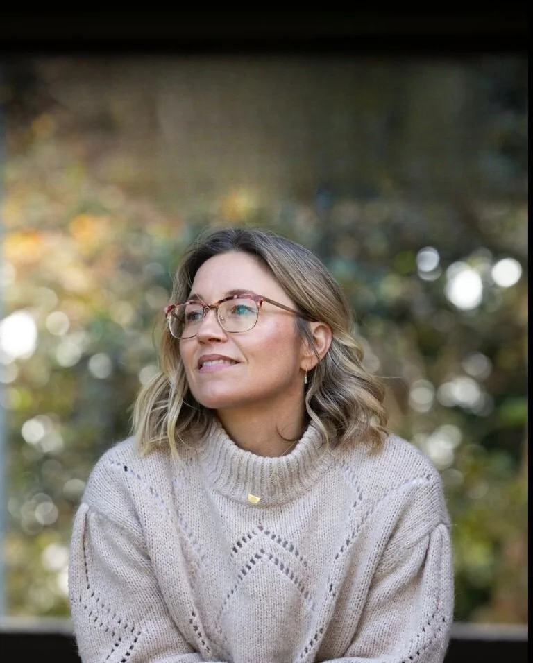 Anna-Klara, Registered Cosmetic Nurse and skincare expert, outdoors with blurred trees in the background.