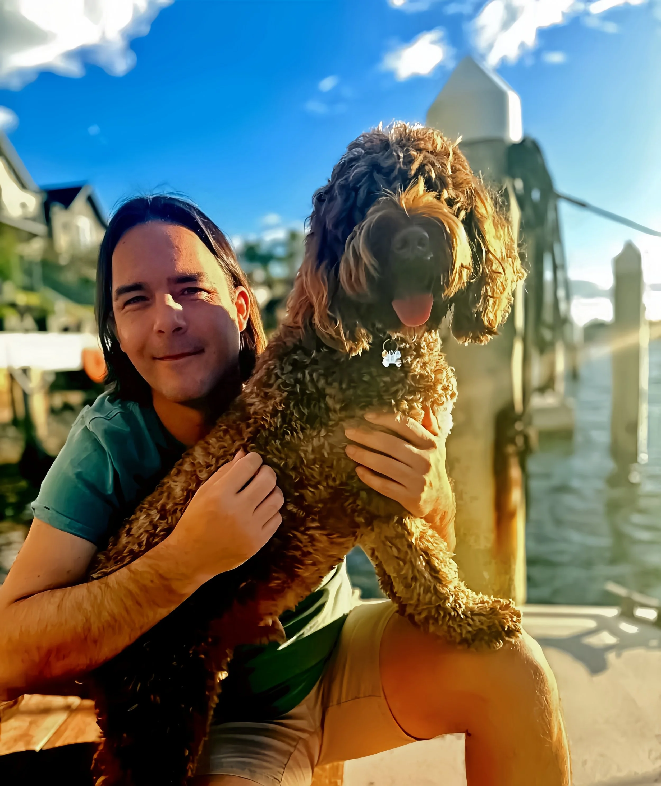 Oliver, co-founder of Flow Republic, with his dog Chester overlooking the Sydney waterfront, embodying the connection, community and conscious lifestyle at the heart of Flow Republic.