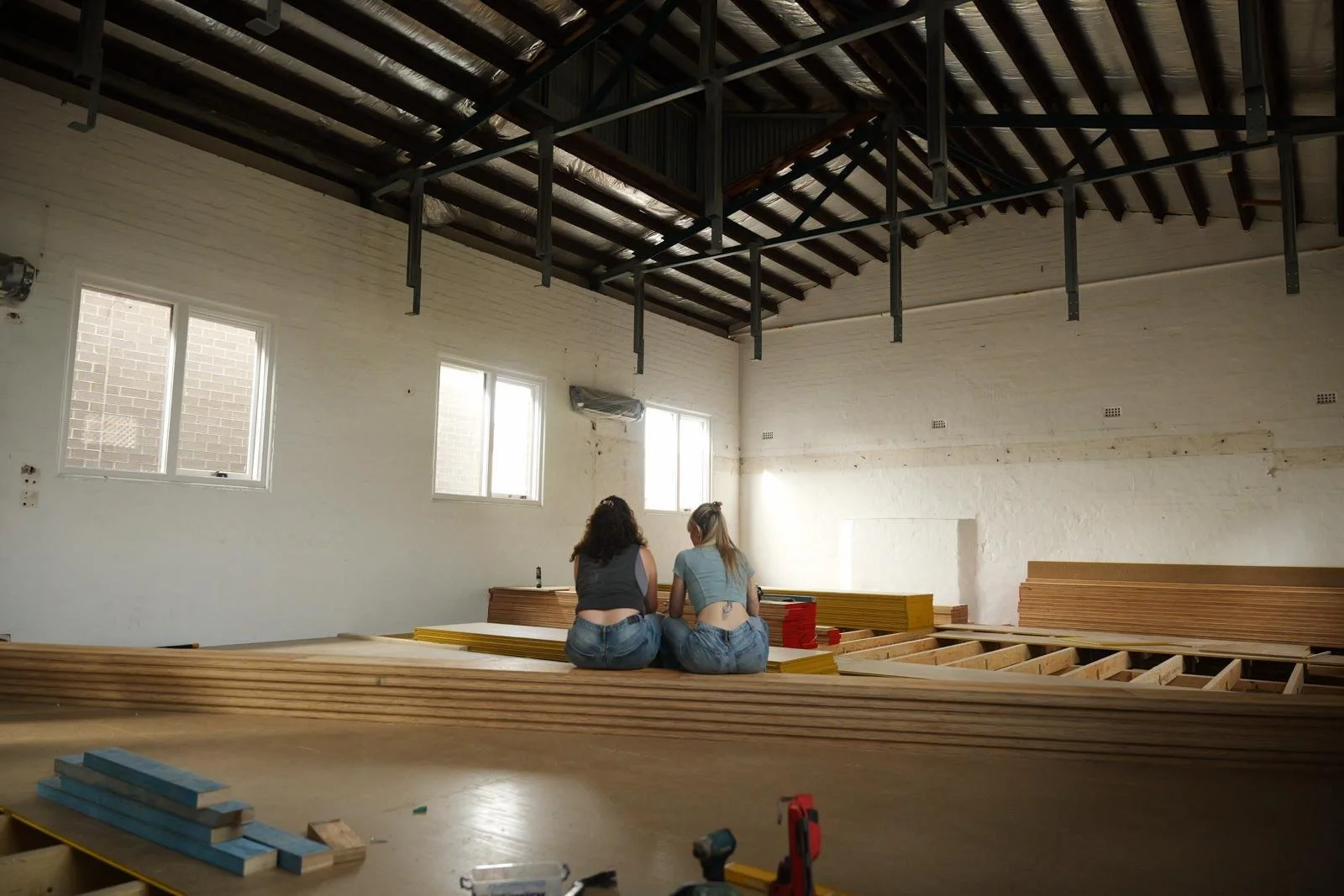 Flow Republic founder and yoga teacher in the studio during construction, reflecting the care, vision and community behind the Rozelle yoga, meditation, wellness and sound studio.