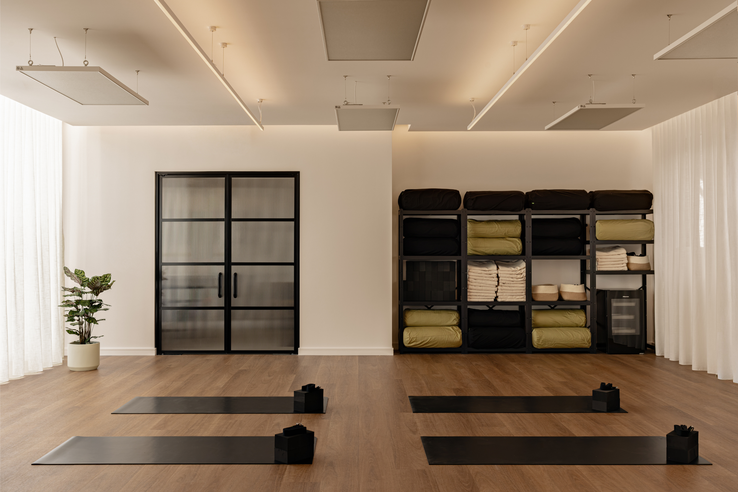 Yoga practice space at Flow Republic in Rozelle, Sydney, featuring modern yoga mats, bolsters, blankets, blocks and thoughtfully designed studio interiors.