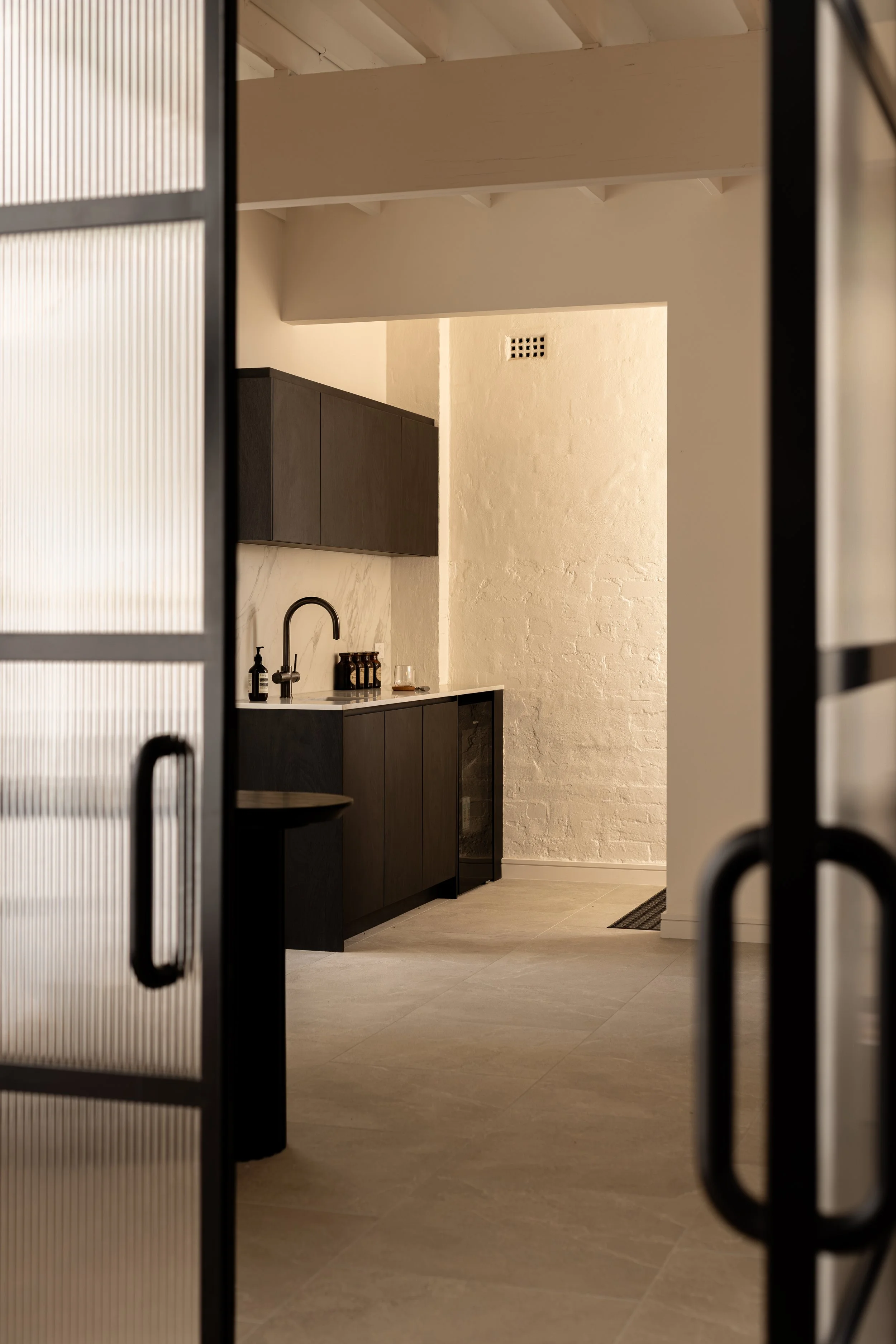 Light-filled refreshment and reception space at Flow Republic, a premium yoga studio in Rozelle, Sydney.