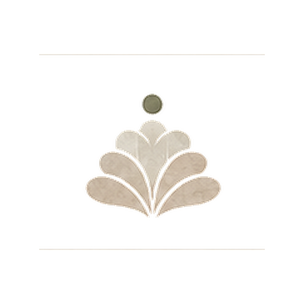 Close-up of a decorative emblem with a gray circular top and cream-colored symmetrical leaf or feather design on a black background.