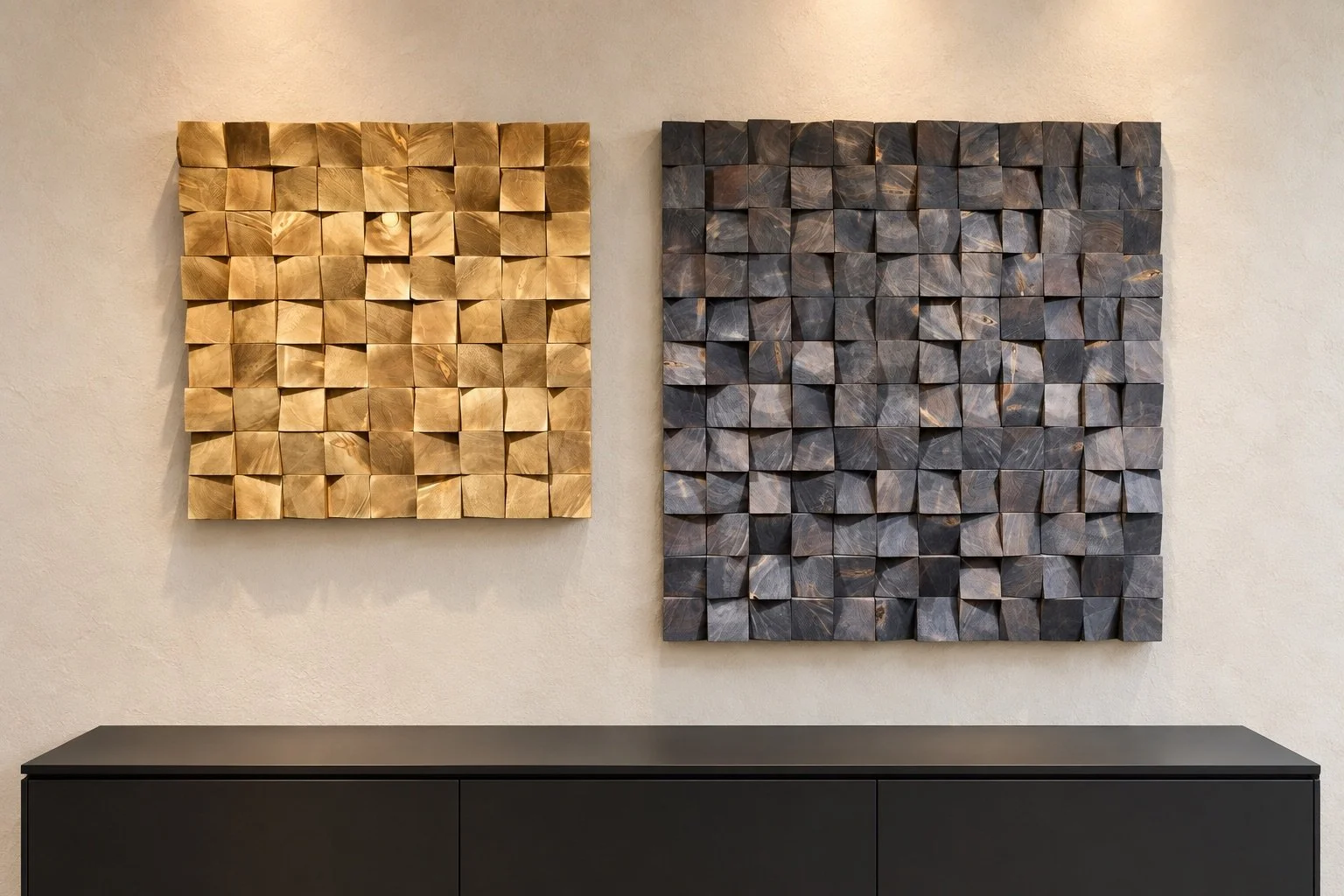 Two handcrafted timber wall artworks in gold and charcoal finishes above a black sideboard.