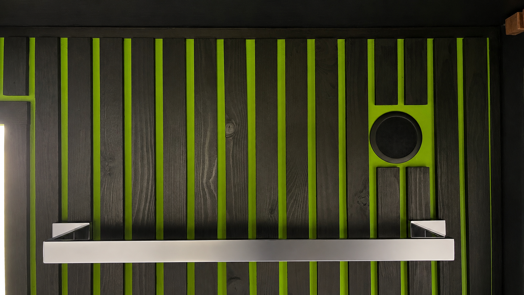 Integrated Bluetooth speaker within the cedar-clad interior of the PLUVIA outdoor shower room