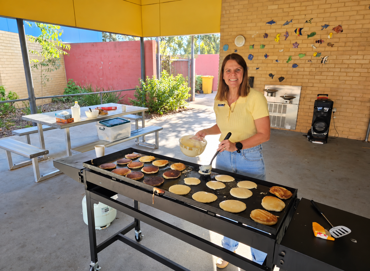 Rebecca Kirkwood preparing pancakes at school