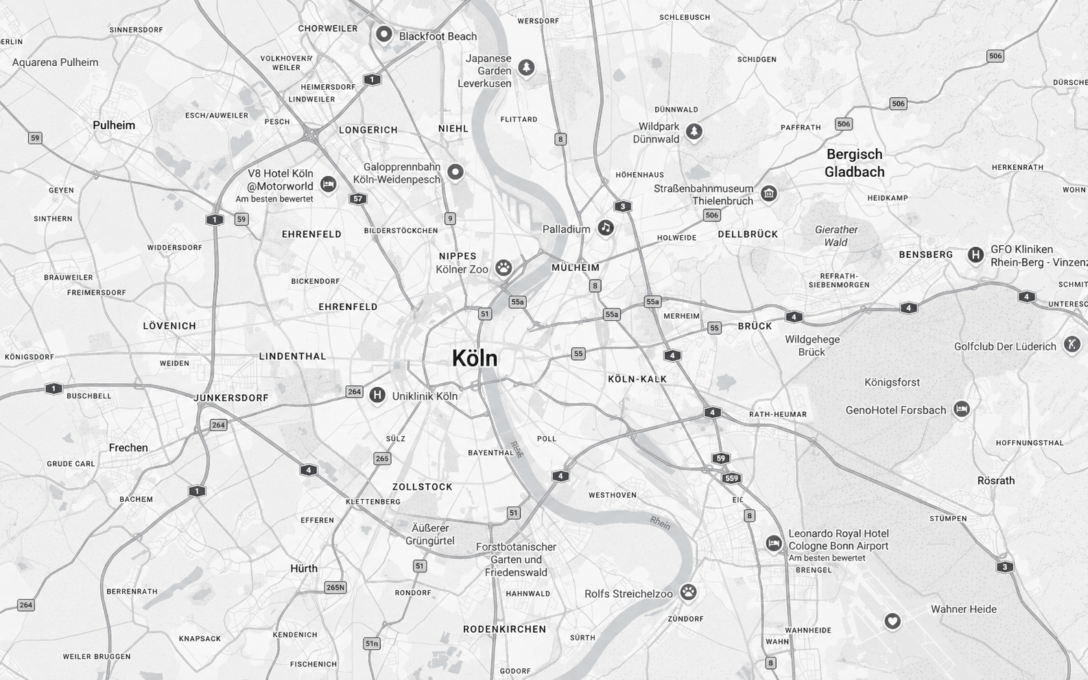 A grayscale map of Cologne, Germany, showing city neighborhoods, roads, and points of interest including hotels, zoos, museums, and parks.