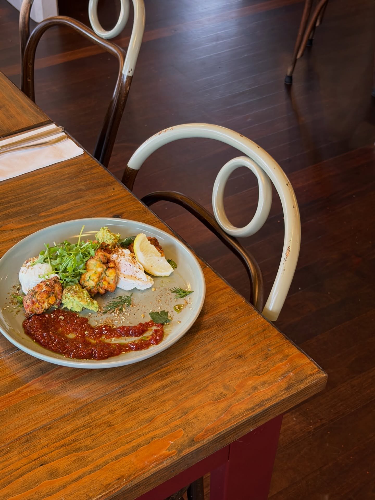 Specials - Zucchini fritters with avocado, house made chilli jam, poached eggs and pistachio dukkah