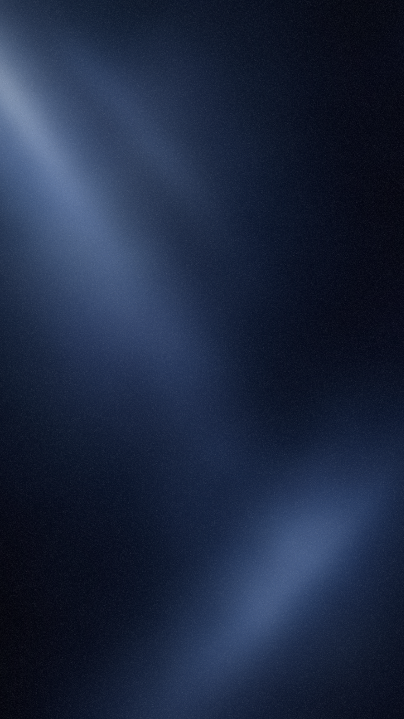 Das Bild zeigt eine dunkle, unscharfe Oberfläche mit einem diagonalen Lichtstrahl, der einen bläulichen Schimmer aufweist.