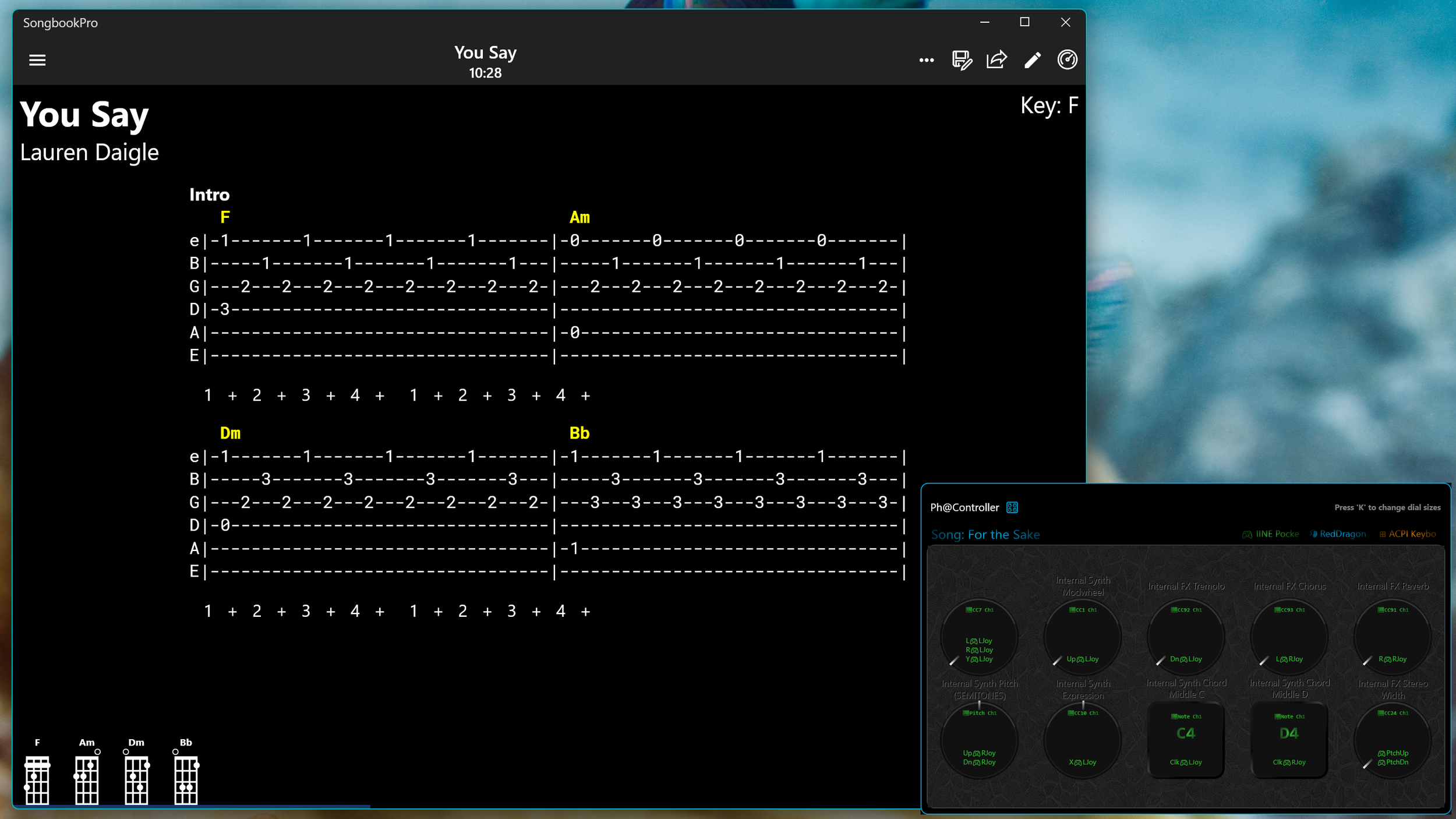 Screenshot of guitar tablature for the song 'For the Sake' by Lauren Daigle, showing chords F, Am, Dm, and Bb, with corresponding finger positions and chord diagrams at the bottom. The application is Songbook Pro, sitting next to Ph@Controller app.