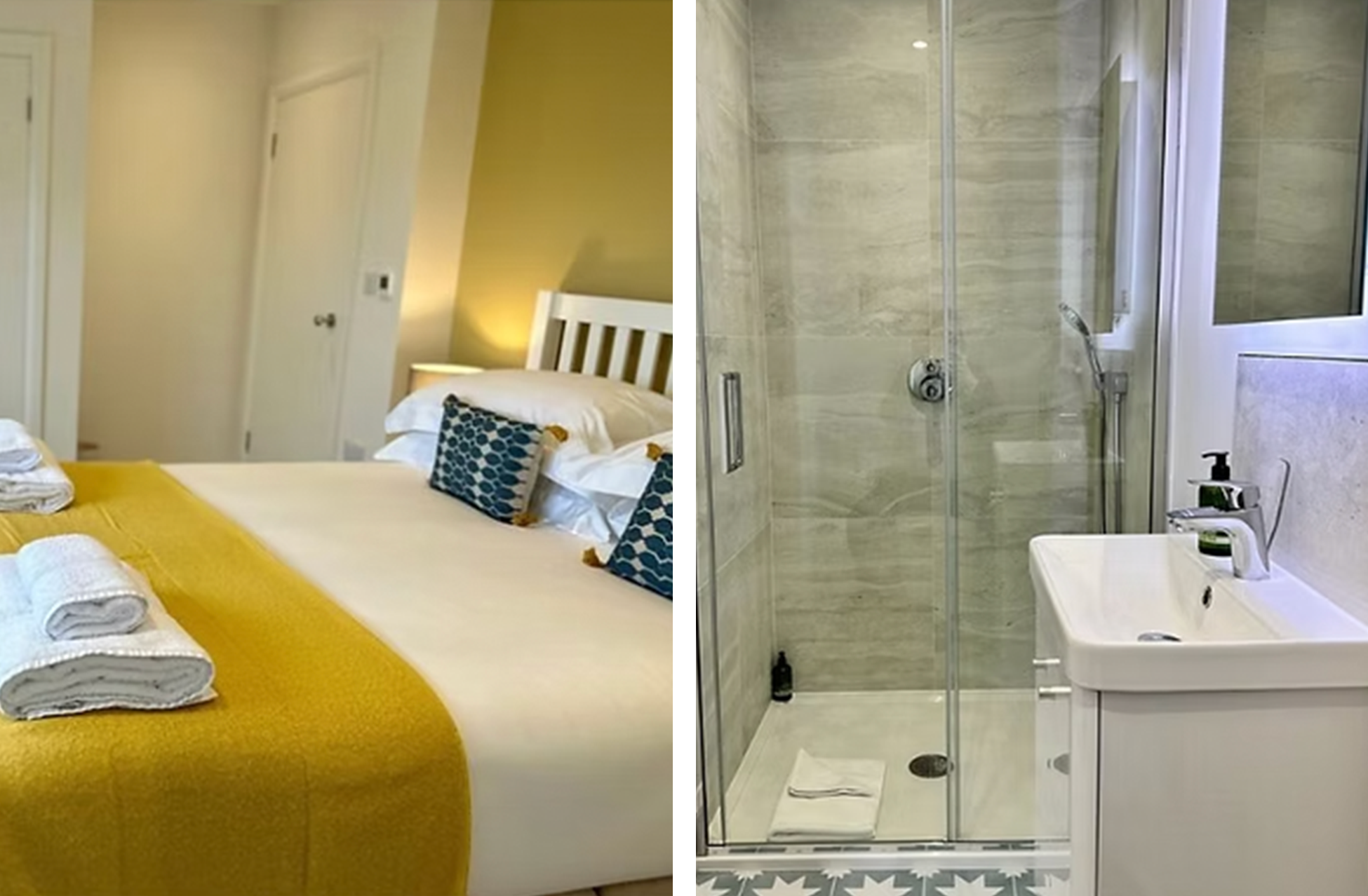 A bedroom with a yellow bedspread, decorated with blue patterned pillows, and a side table with a lamp. A bathroom with a glass shower, a sink, toiletries, and a marble wall is visible.