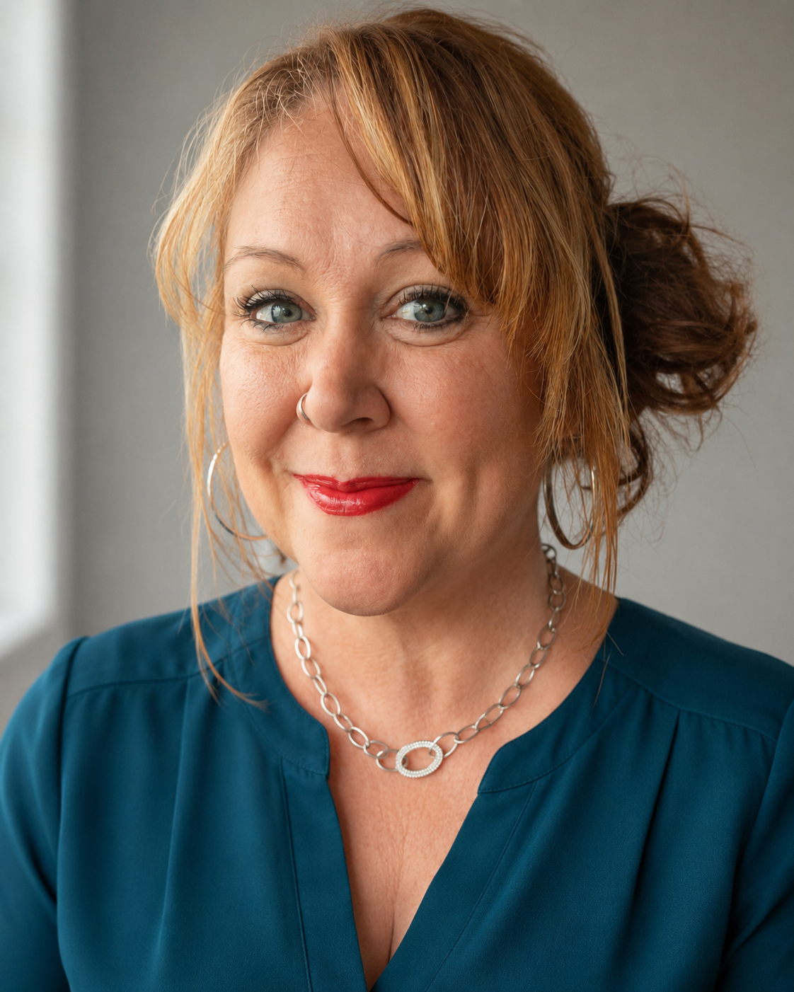 Summer Killebrew, personal growth coach for entrepreneurs, smiling in a blue blouse.