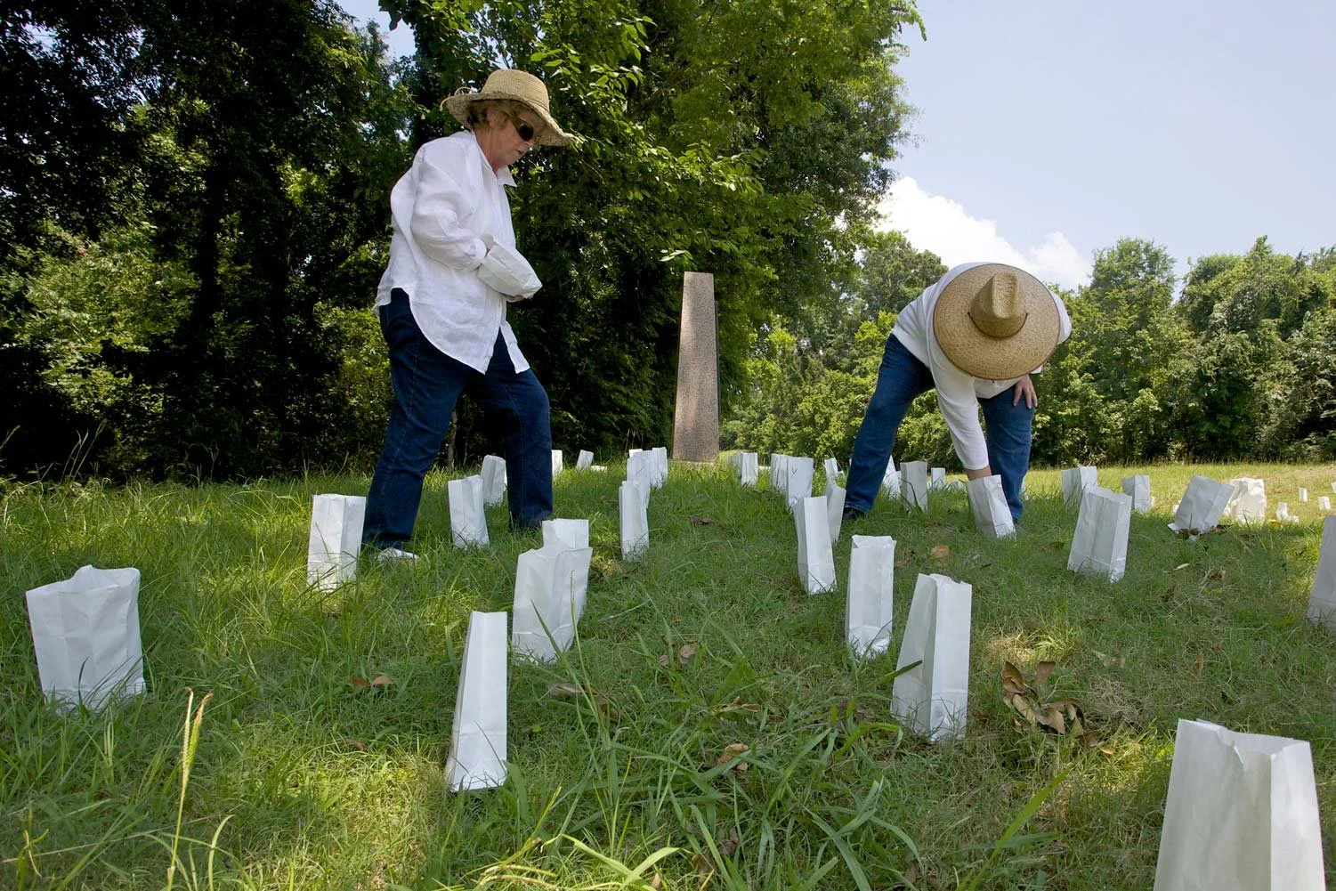 Placing luminaries, one for each soldier killed, wounded, or missing, during the 47-day Siege of Vicksburg.