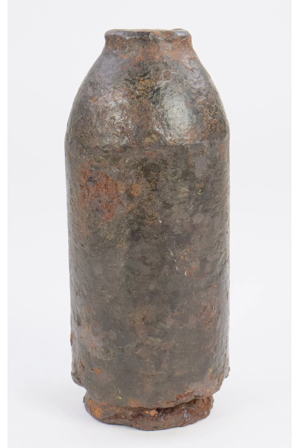 Ancient rusted clay or ceramic vessel with chipped base, possibly an archaeological artifact.