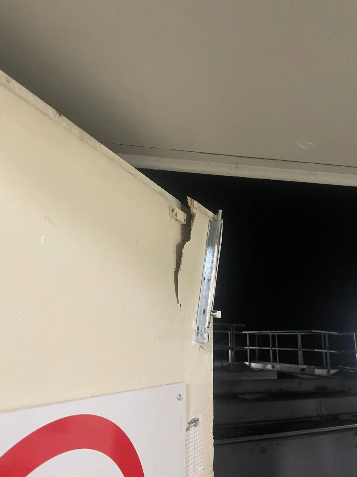 broken fire exit at sports direct overage Dundee. attempted break in. repaired by Gallier Locksmithing. silver security bolt at the top of the door pulled out of the door.