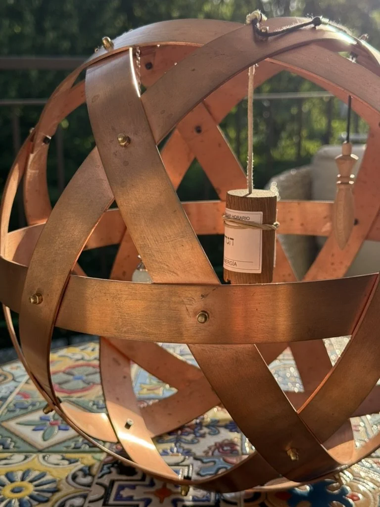 Genesa Pentasfera featuring suspended energy pendulums, including a Hebrew Pendulum, used in integrative holistic healing and energy balancing sessions.