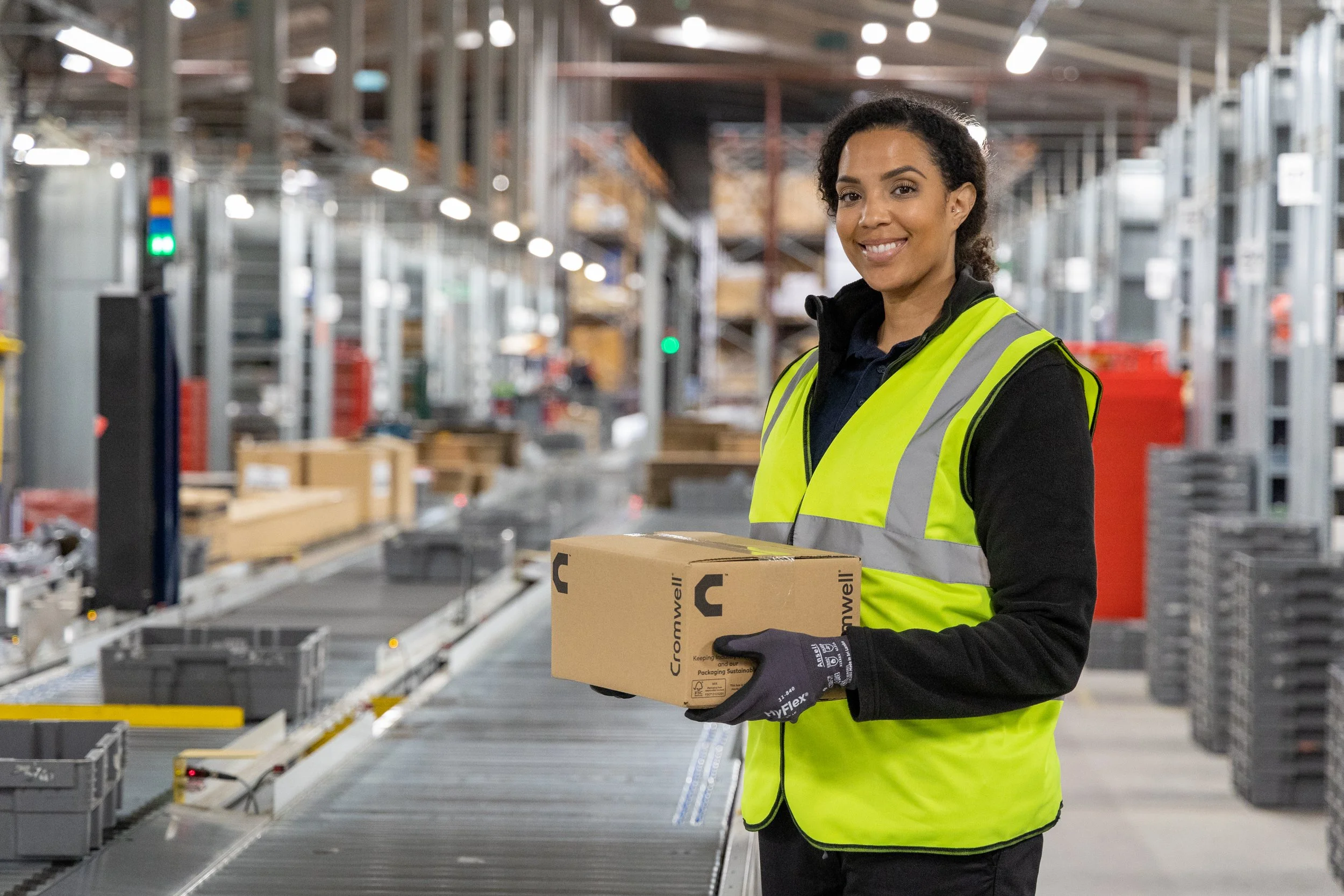 Warehouse photography woman holding a box