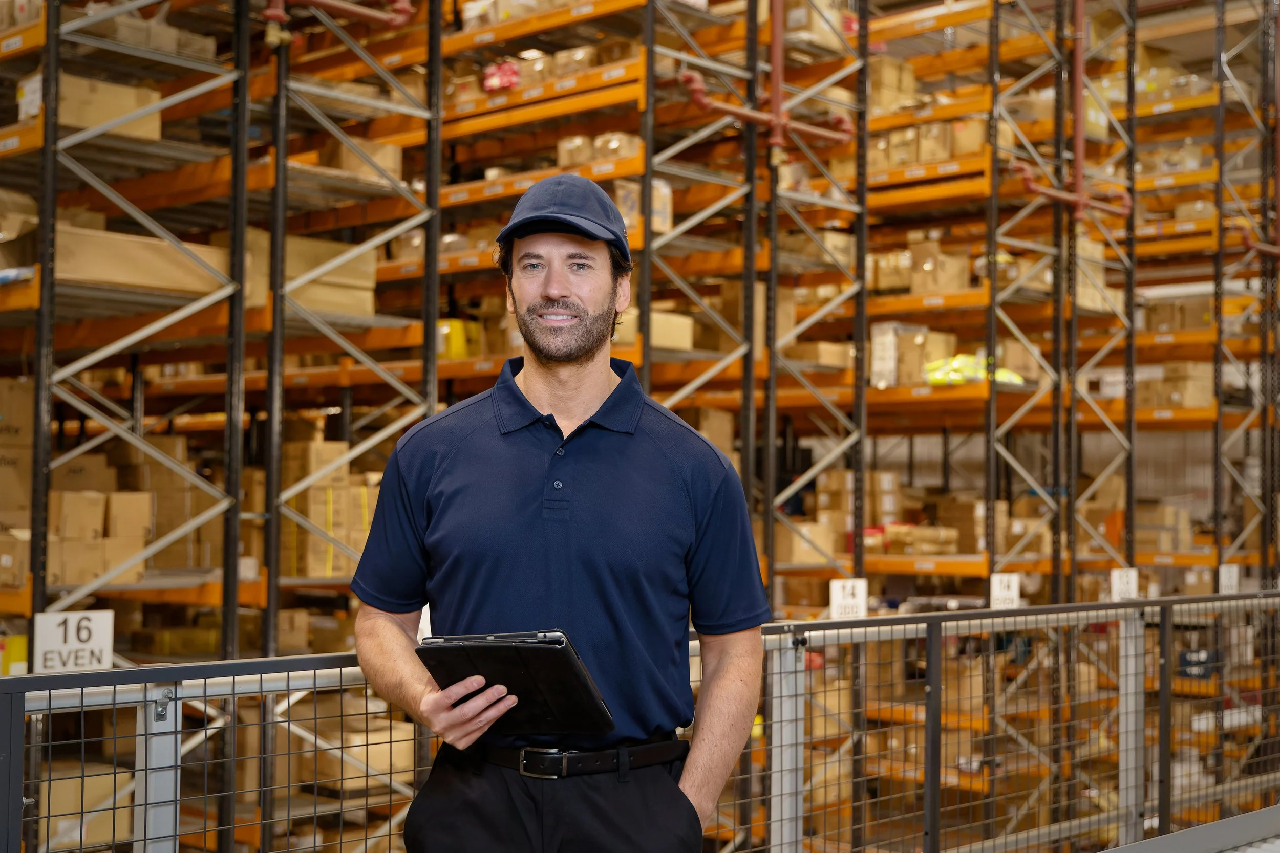 Warehouse photography man with cap and clipboard