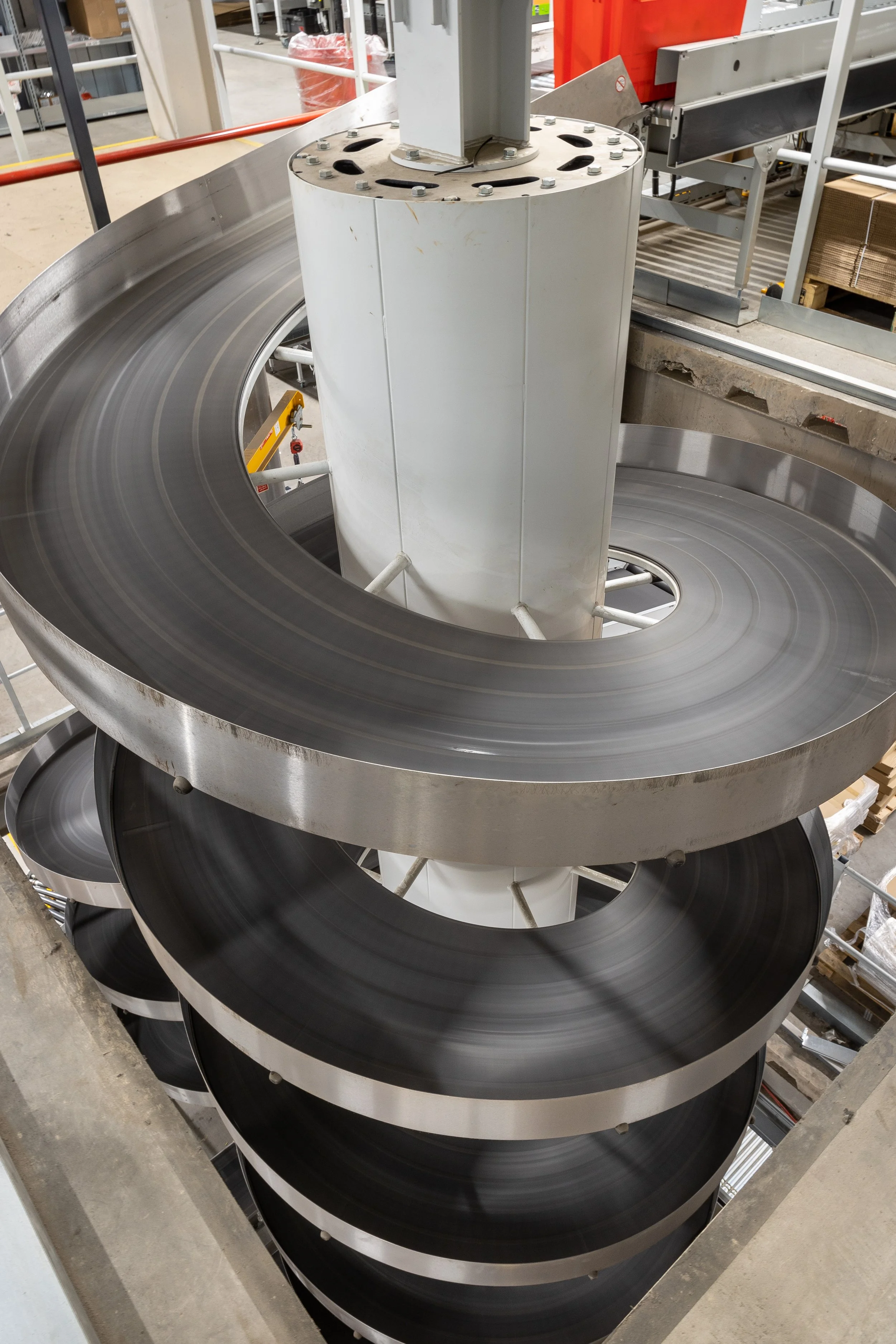 Warehouse interior spiral conveyor belt