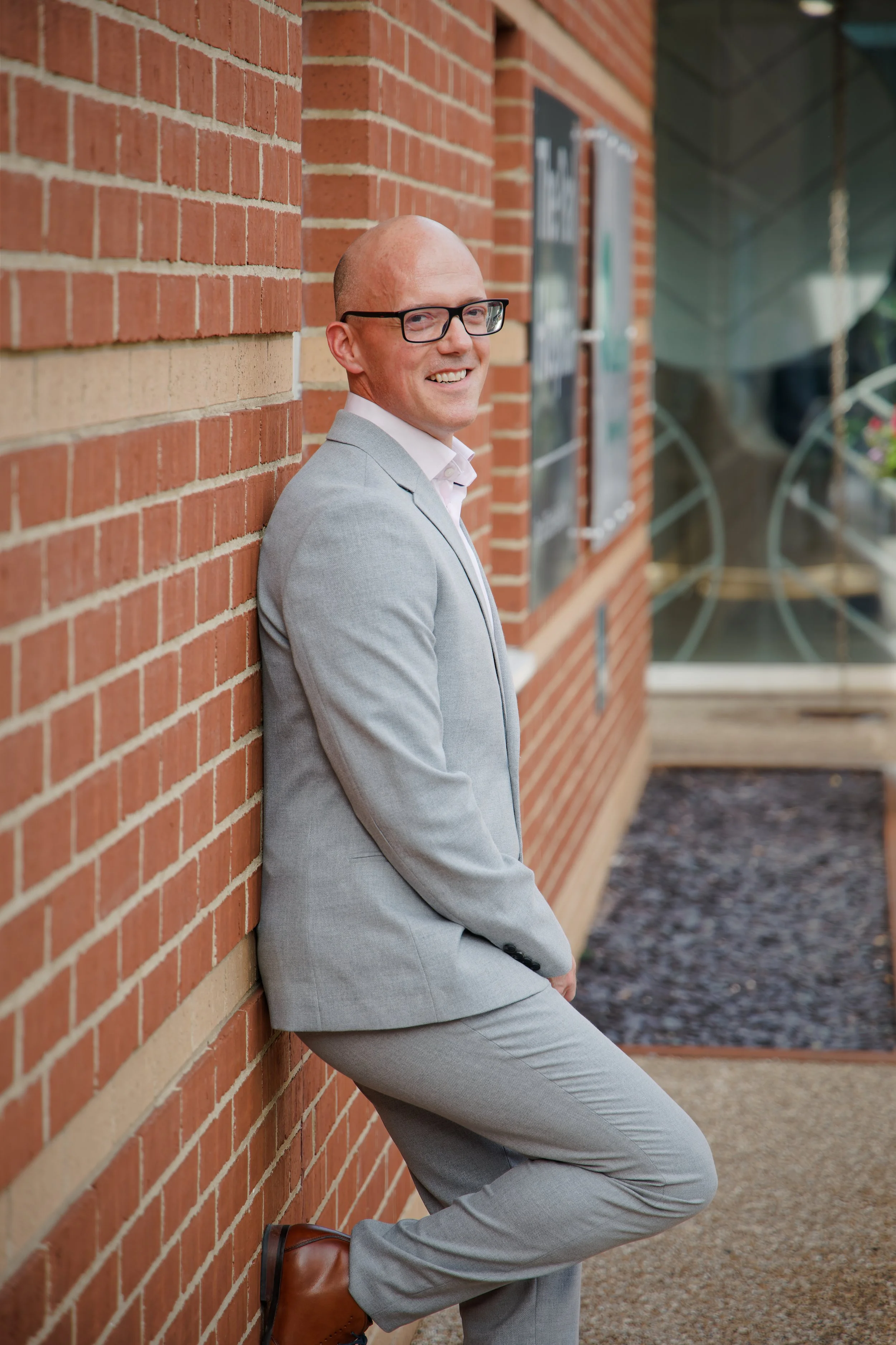 Healthcare photography doctor wearing gray suit portrait