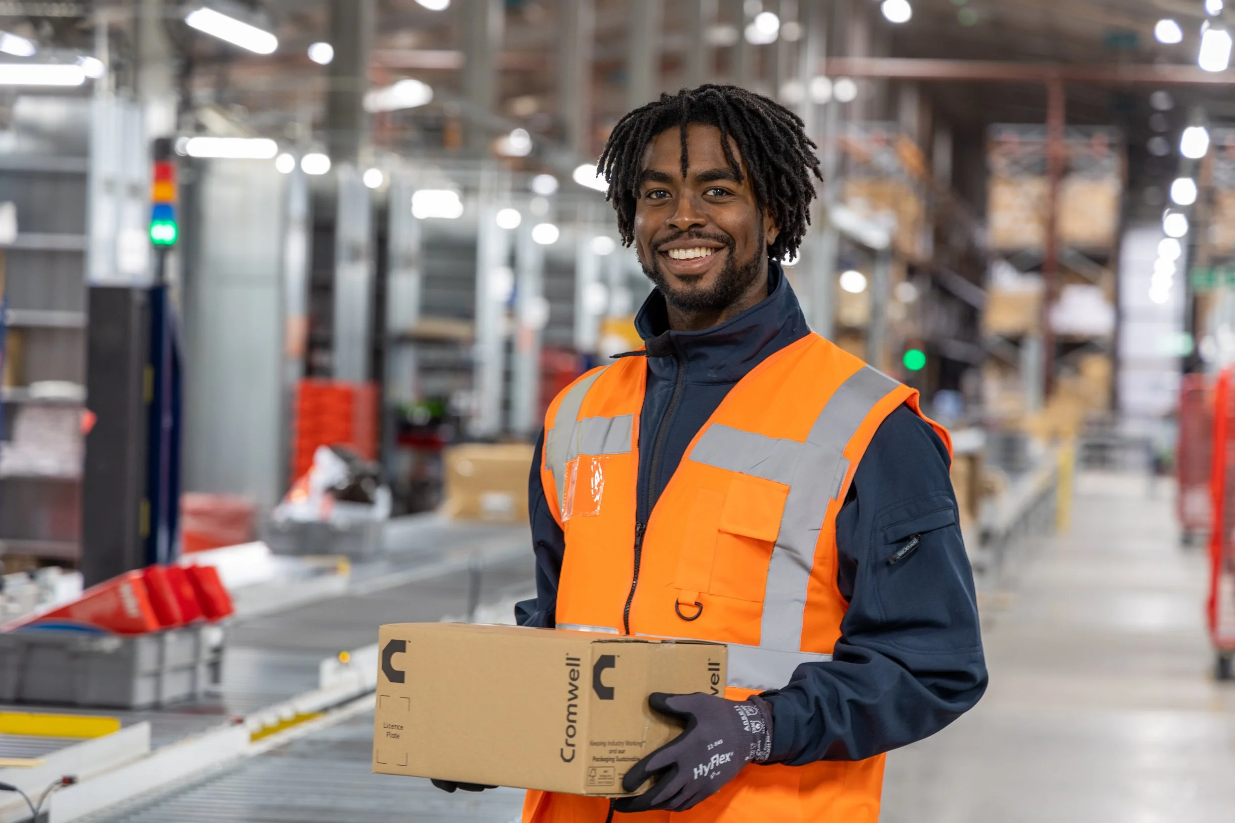Warehouse photography man holding a box