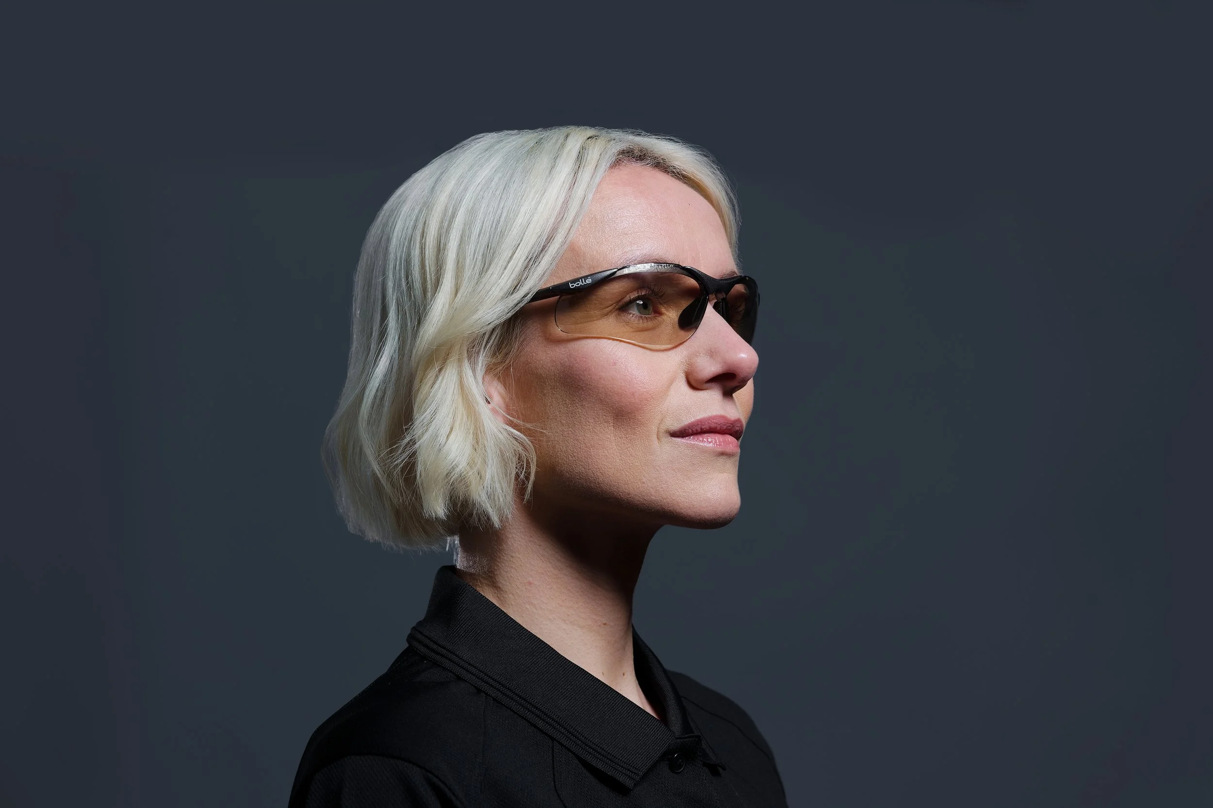 Headshot of a woman wearing tinted safety glasses
