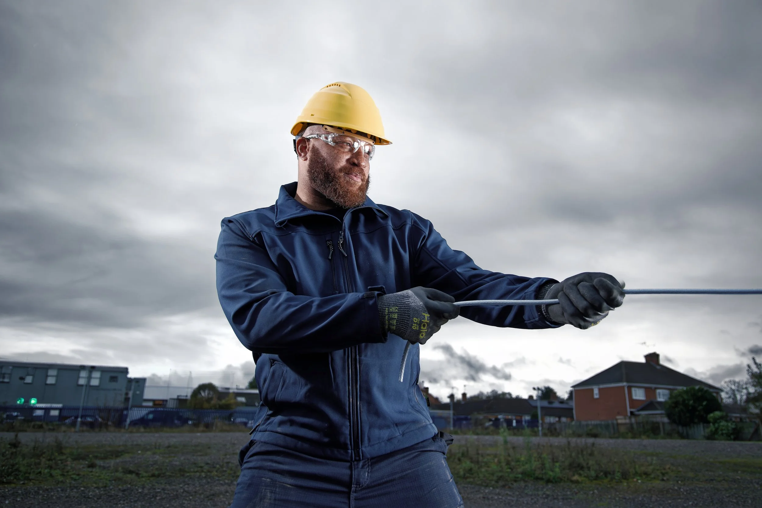 Construction worker pulling rope