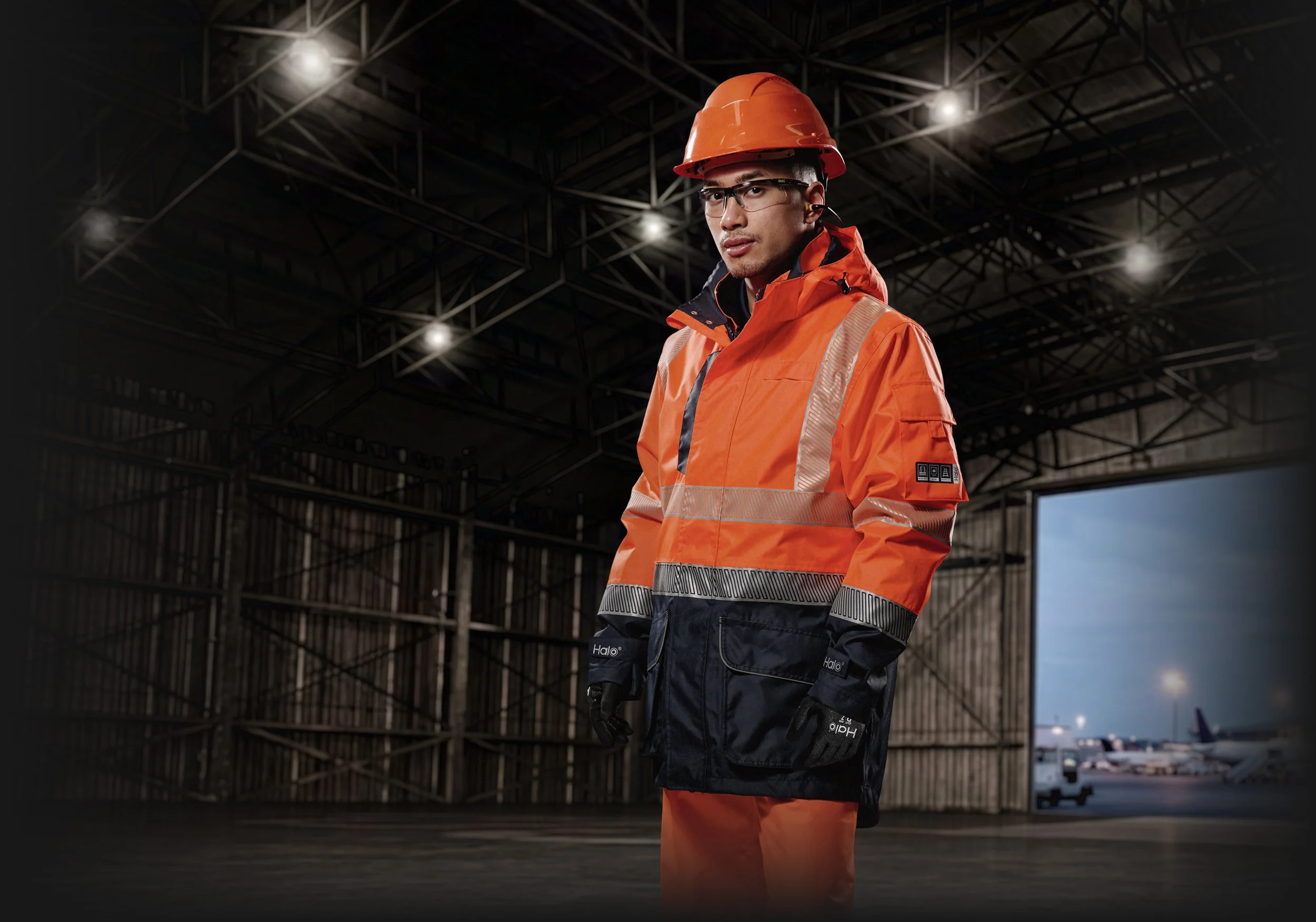 Man wearing PPE in hangar