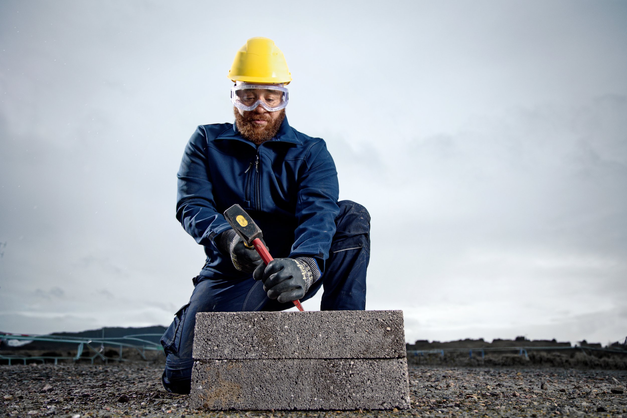 Construction worker using chisel