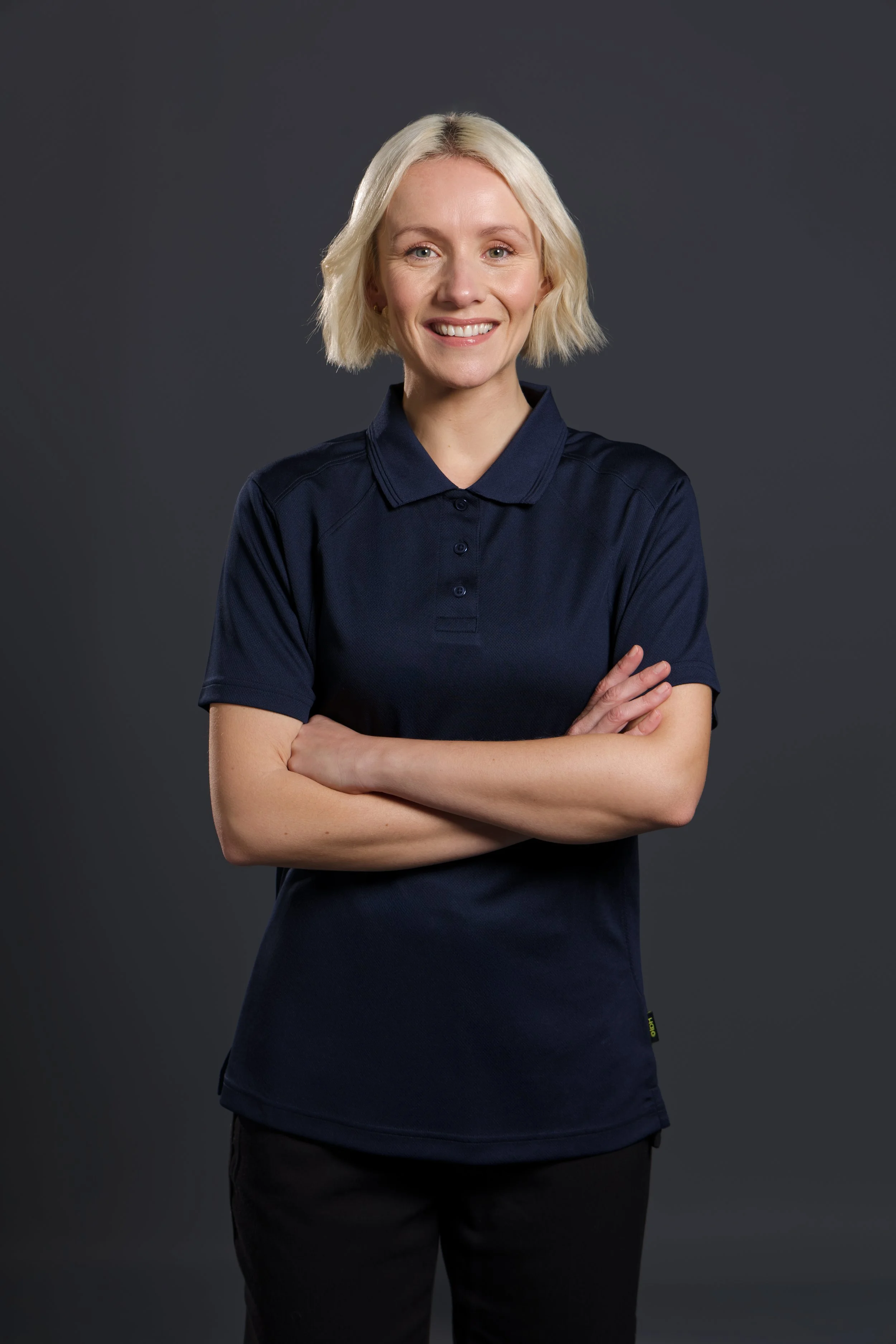 Headshot  of a woman wearing a polo shirt